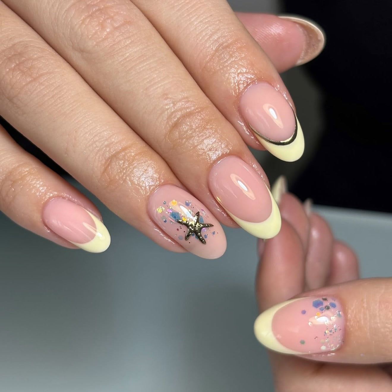 6. Starfish and Sparkle Yellow French (Yellow French Tip Nail Ideas)