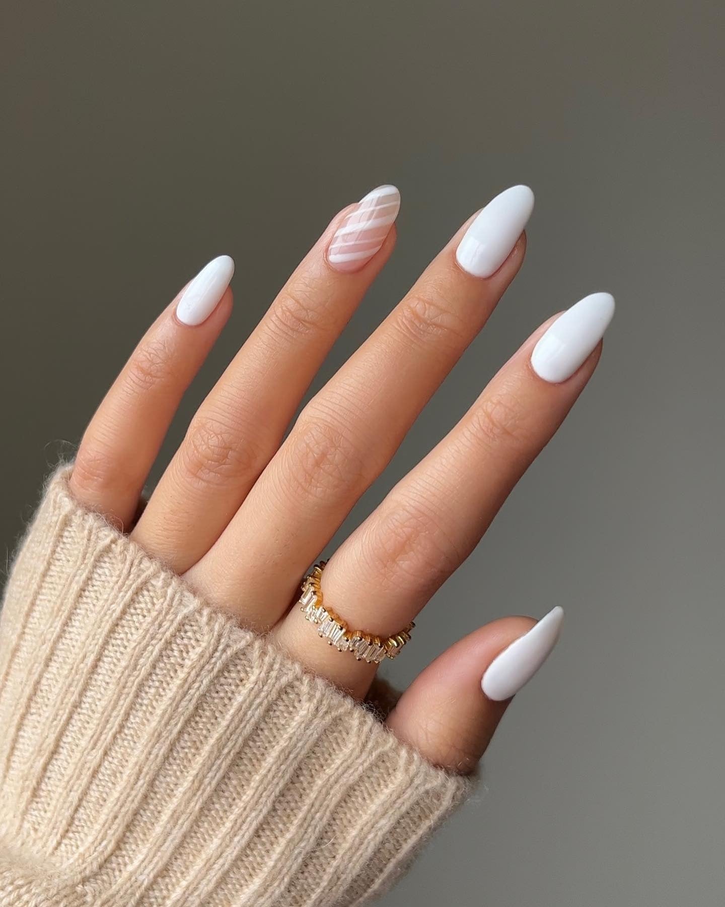 2. Minimal White Almond with Candy Stripe Accent (White Winter Nail Ideas)