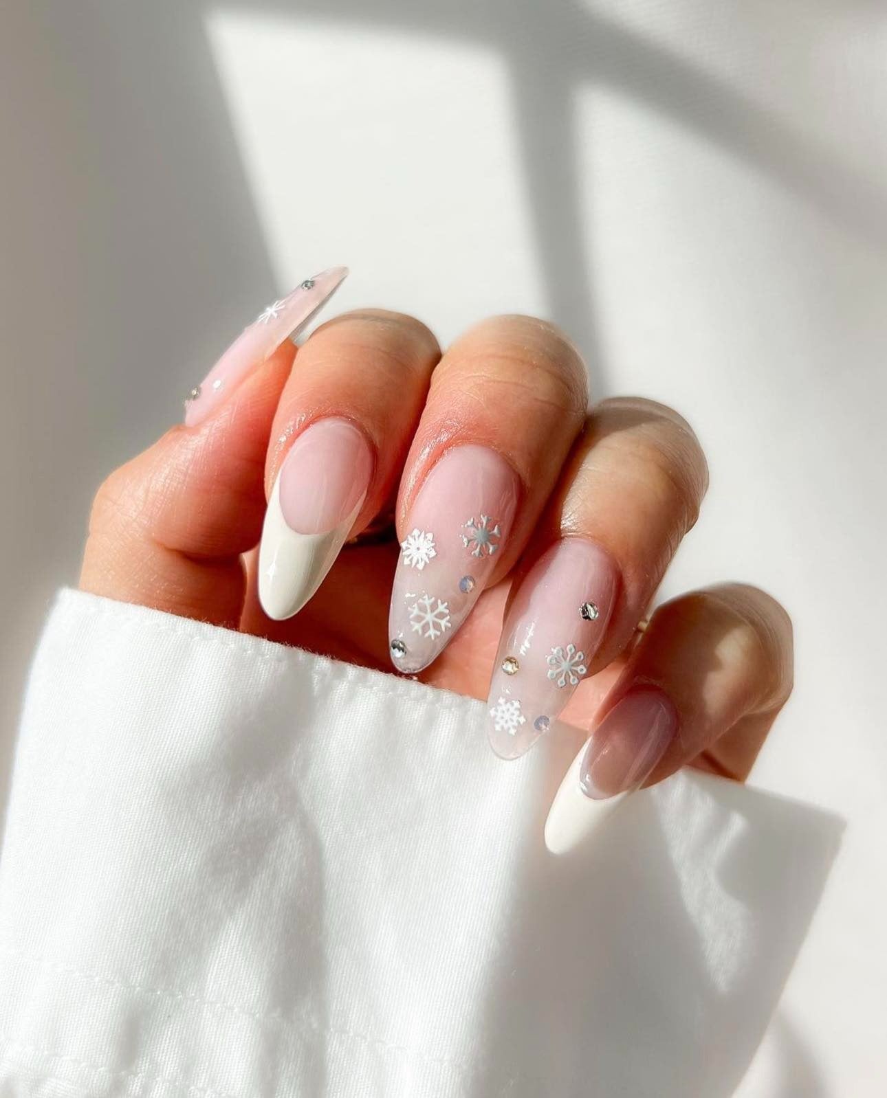 3. Frosted French with Snowflake Details (White Winter Nail Ideas)