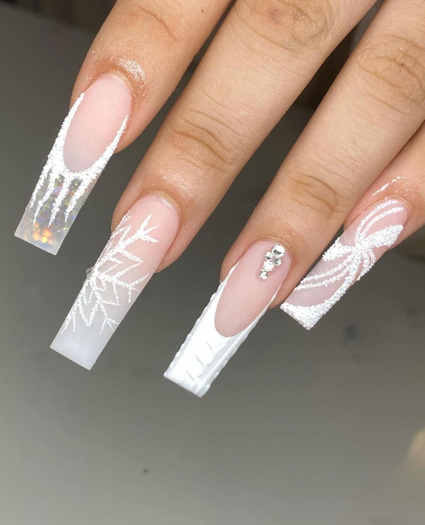 7. Textured White Snowflake and Sweater Knit (White Winter Nail Ideas)