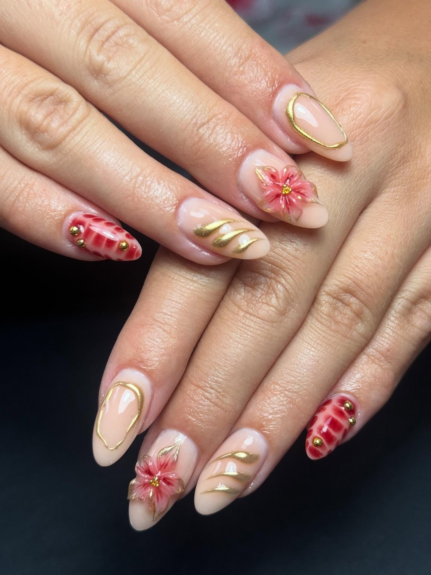 7. Red and Gold Floral Accents (Classy Nail Ideas)