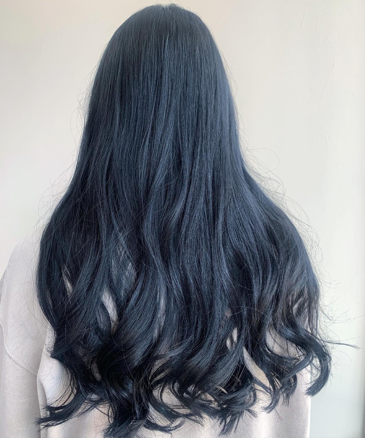 3. Soft Blue-Black Waves (Blue Black Hair Color)