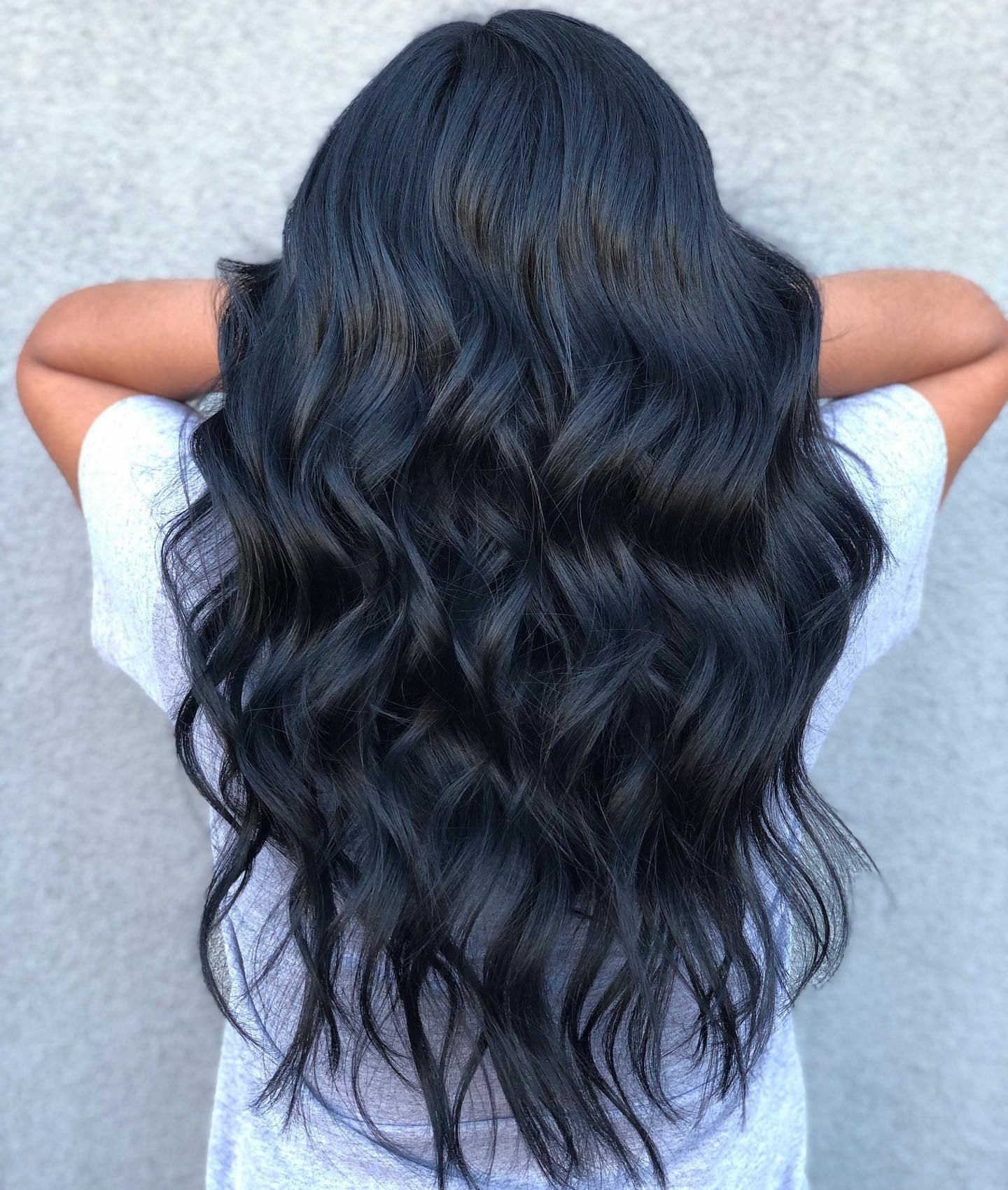 8. Voluminous Blue-Black Waves (Blue Black Hair Color)