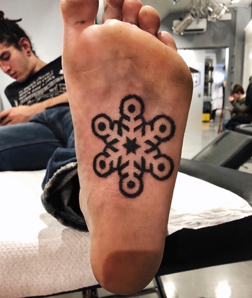Bold Black Snowflake Foot Tattoo