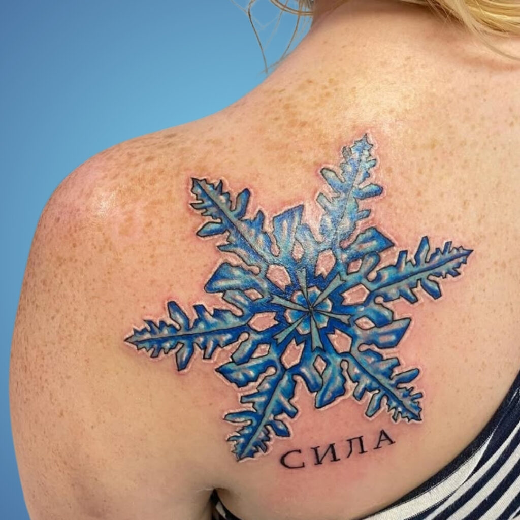 Snowflake Shoulder Blade Tattoo