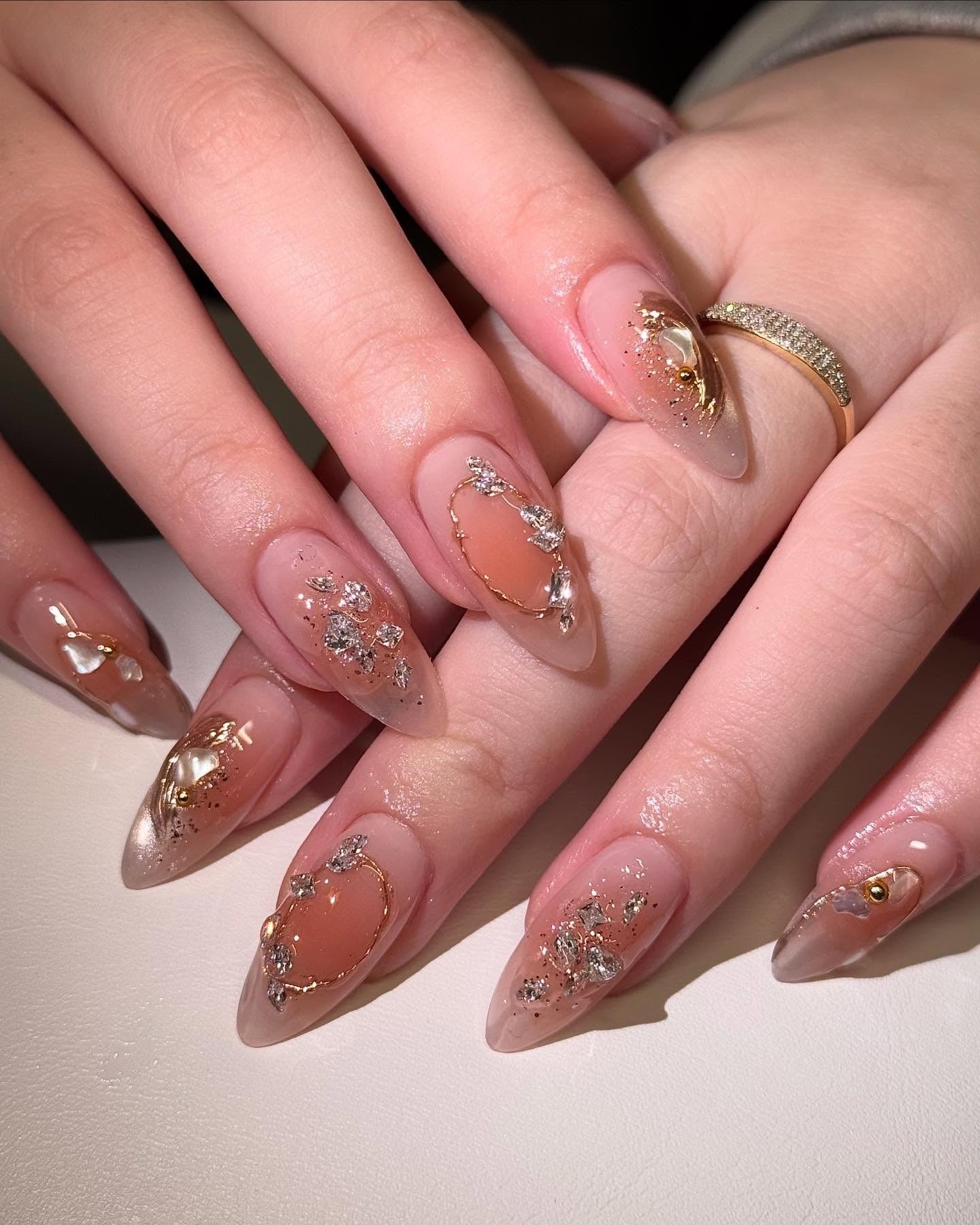 7. Golden Glam Nude with Crystal Foil (Elegant Nail Ideas)