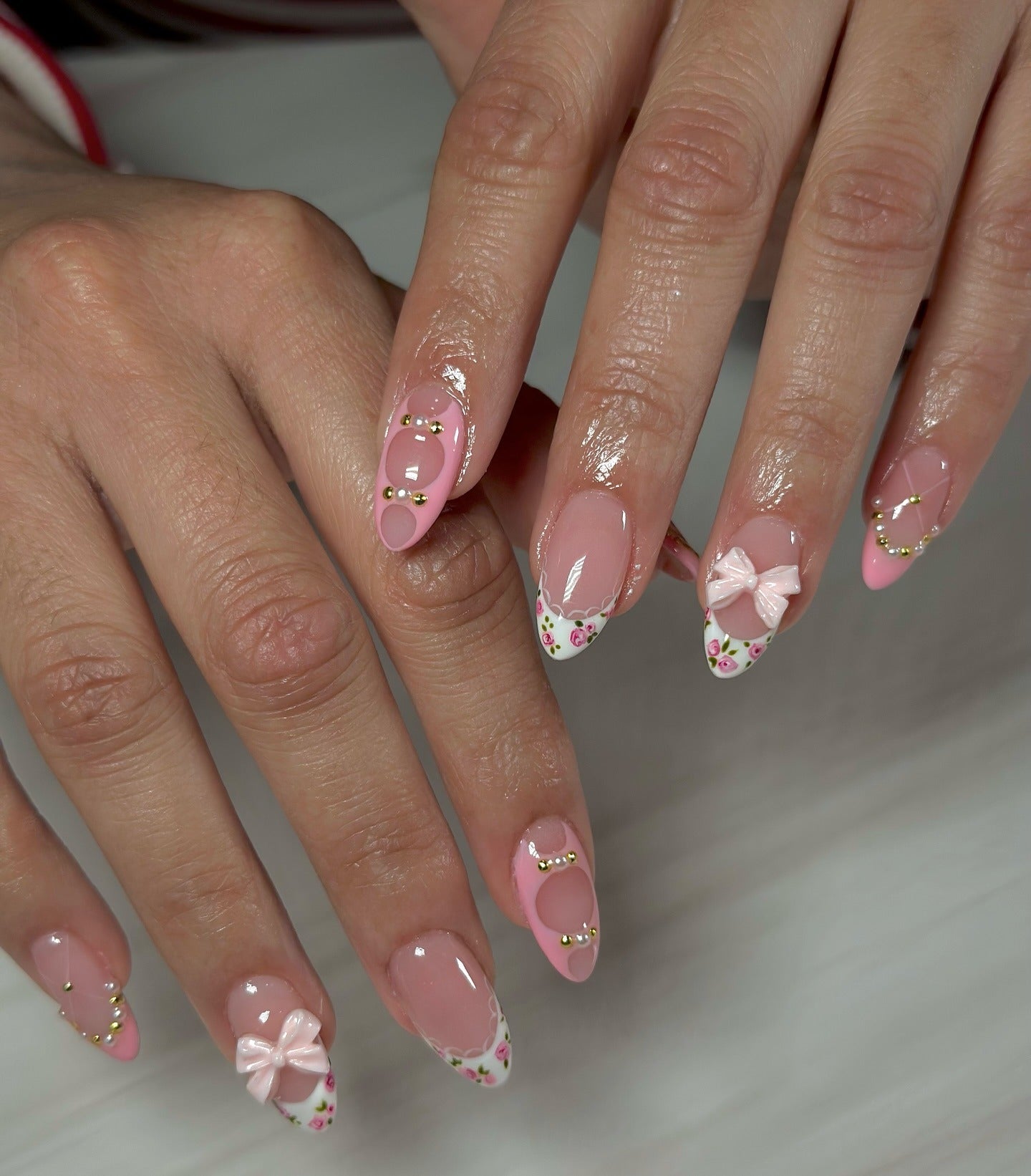 5. Rosy Garden Charm with Bows (Almond Nail Ideas)