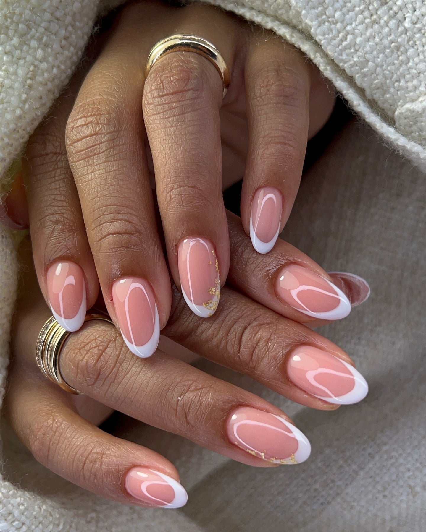 13. Modern White Swoop French with Gold Foil (Almond Nail Ideas)
