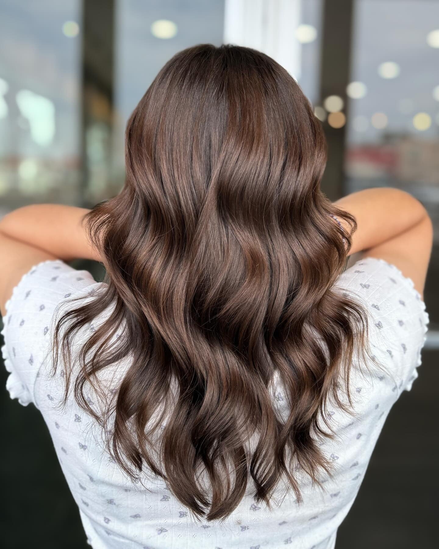 4. Glossy Mocha Waves (Brunette Hair Color)