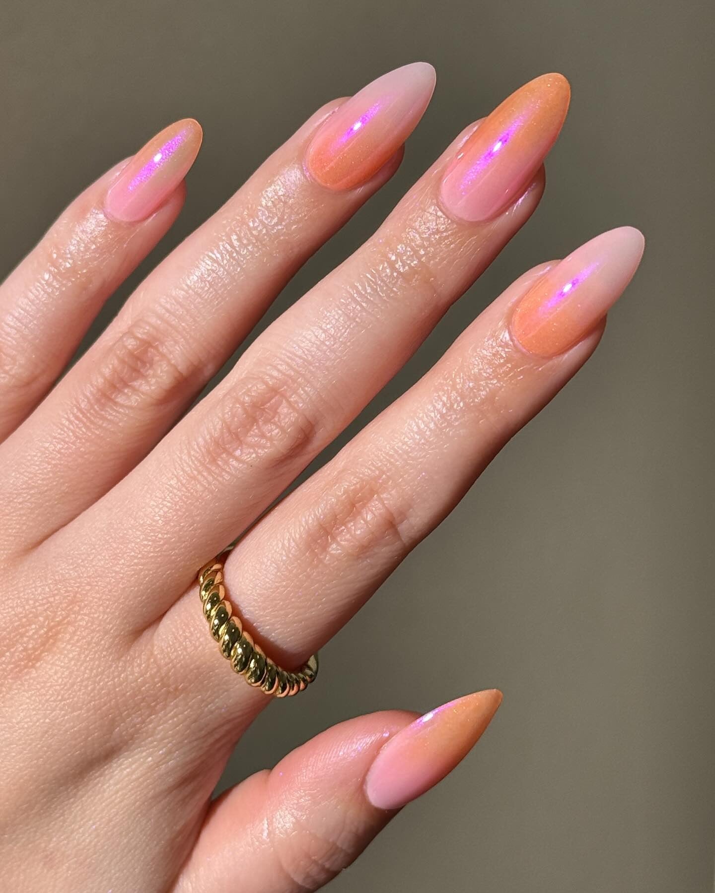 6. Subtle Peachy Glow with Iridescent Hints (Ombre Nail Ideas)