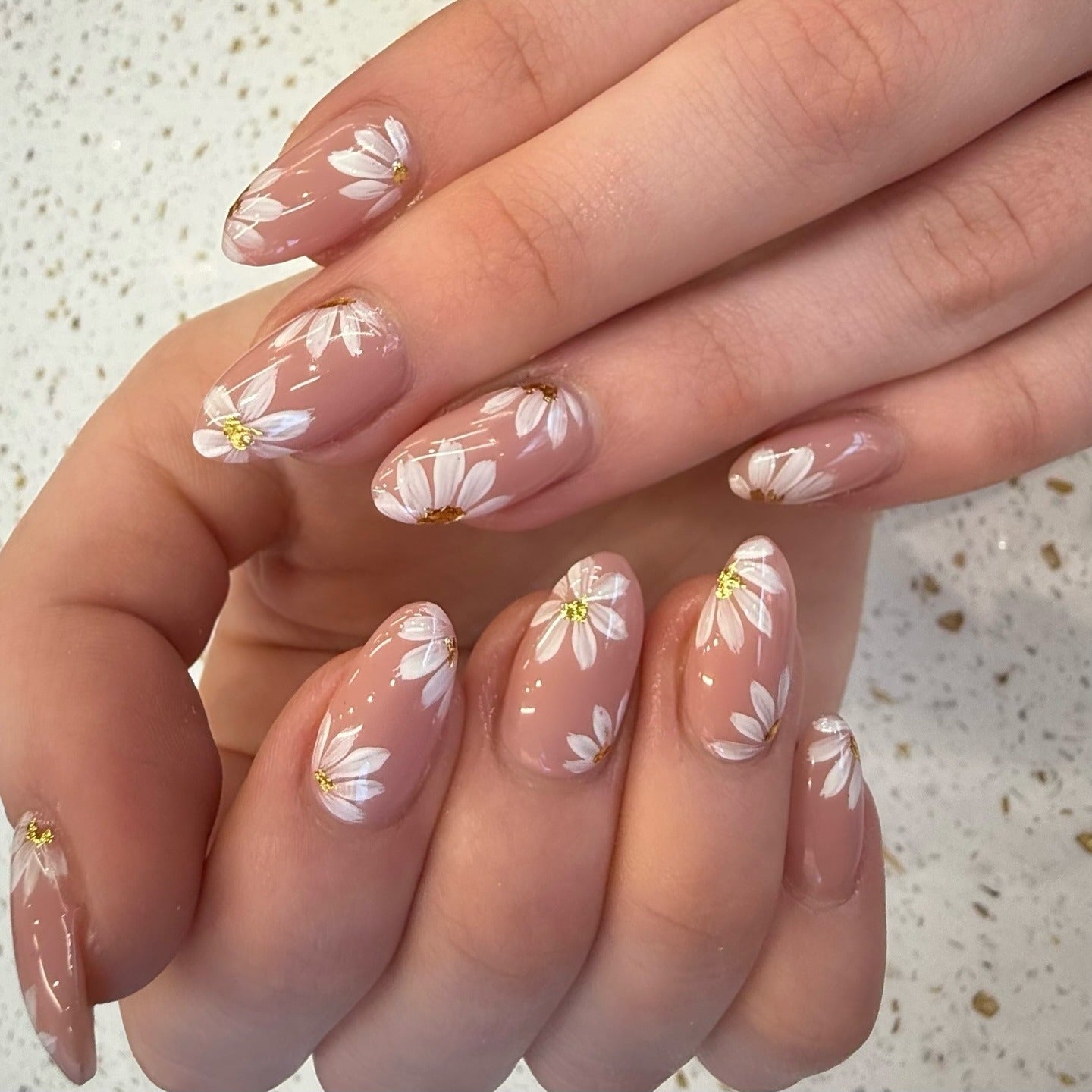 1. Soft Nude Daisies with Gloss Finish (Spring Nail Ideas)