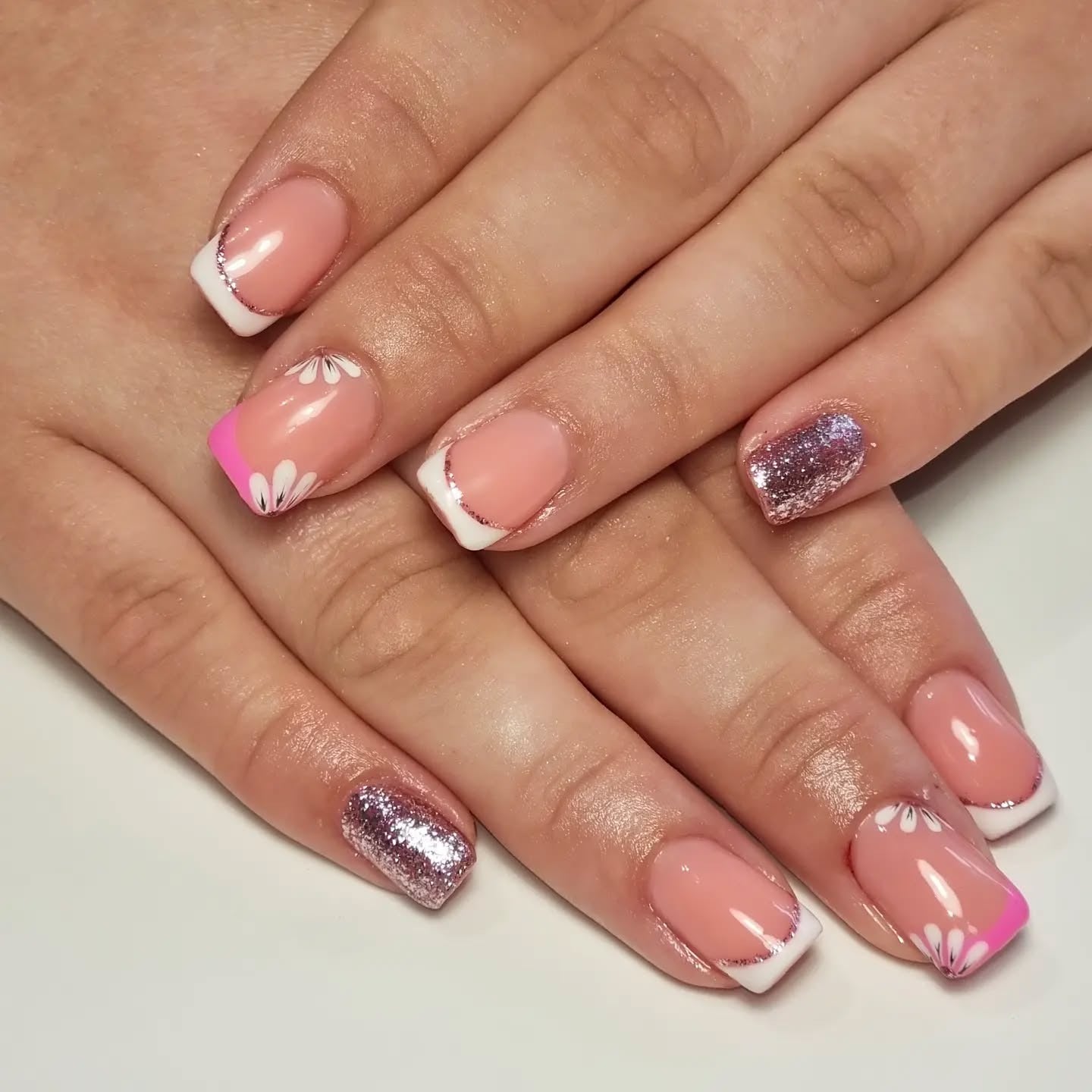 6. Pink French Tips with Daisies and Glitter Accent (Spring Nail Ideas)