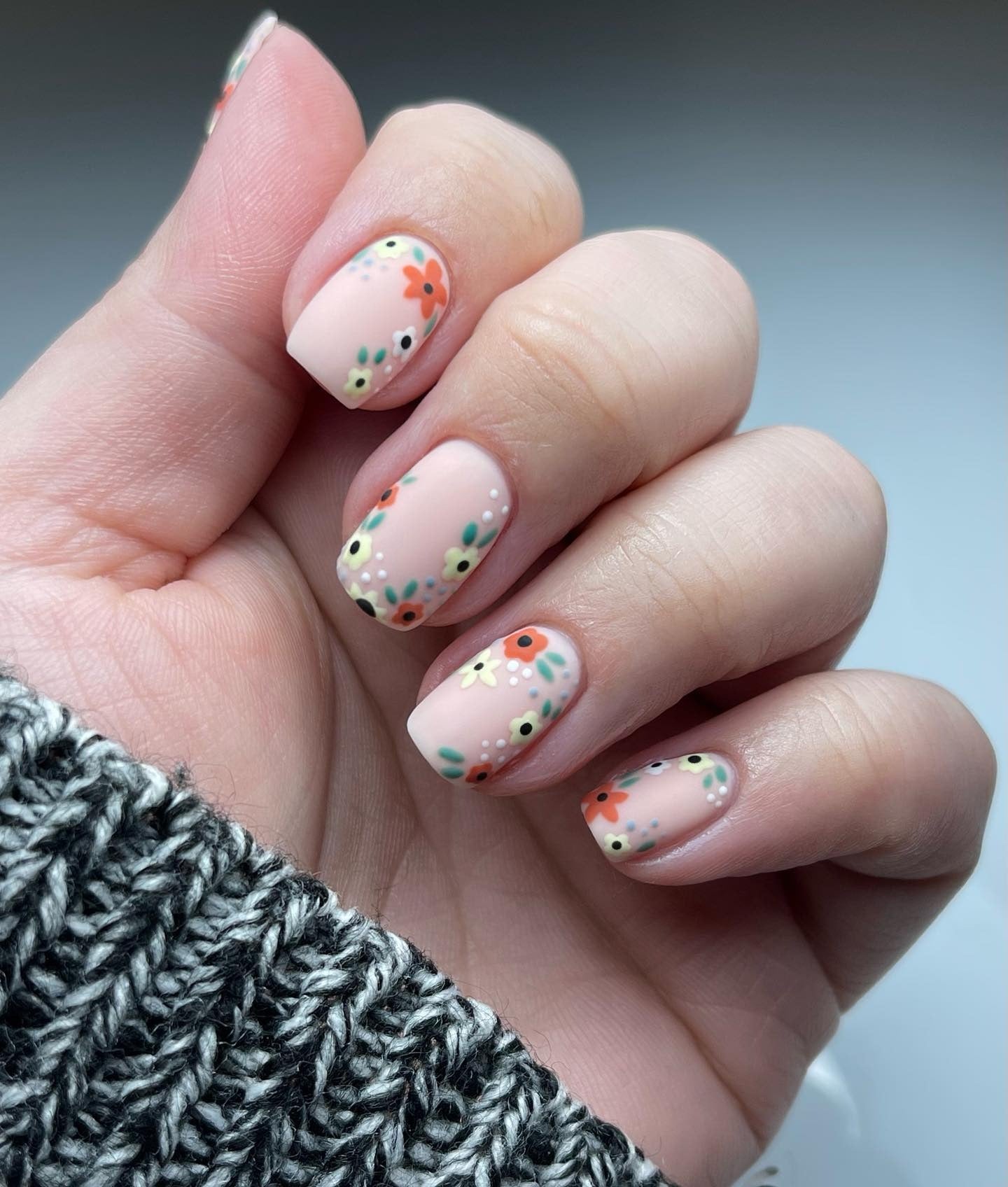 7. Tiny Flower Meadow on Matte Peach (Spring Nail Ideas)