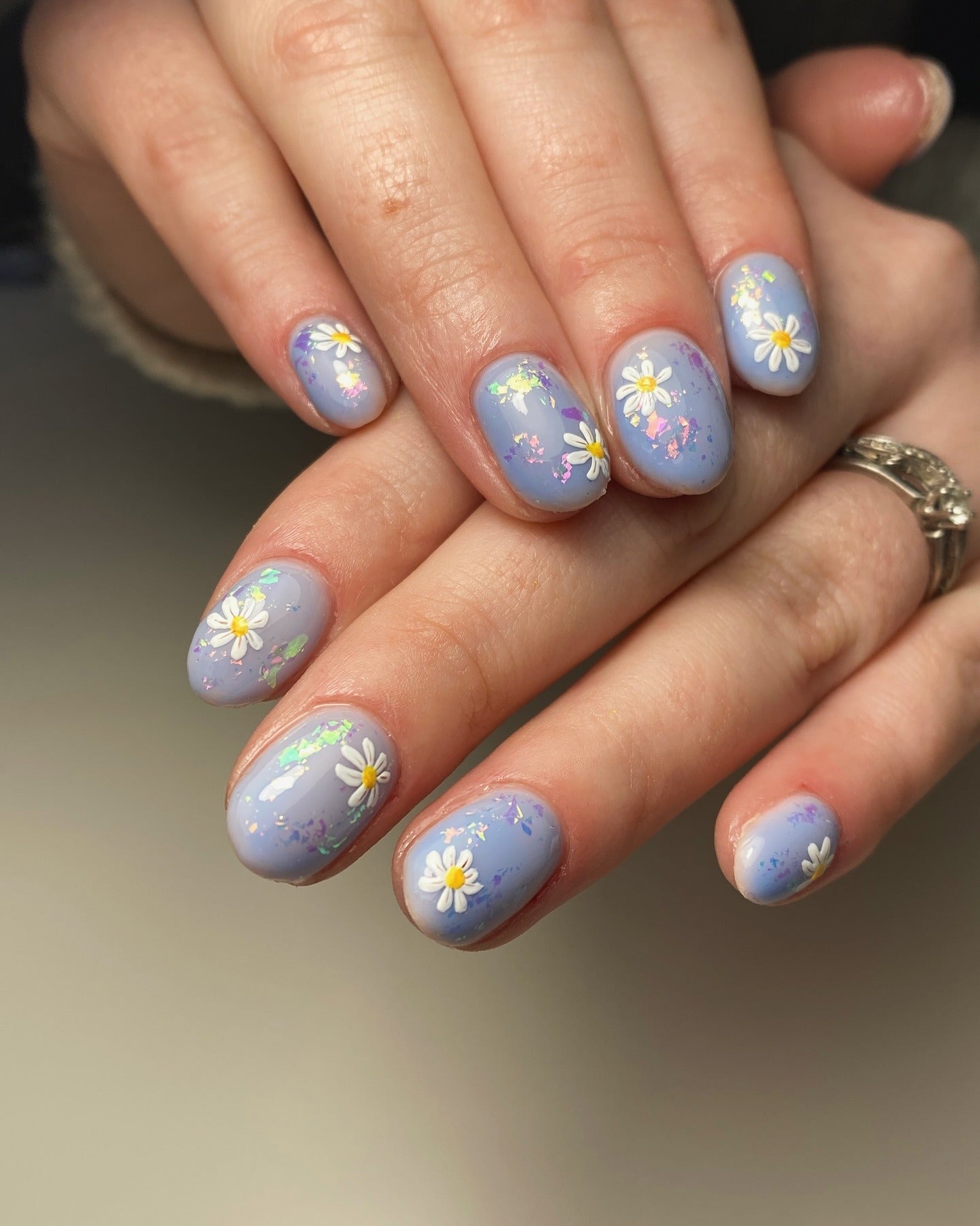 8. Pastel Lavender with 3D Daisies and Iridescent Flakes (Spring Nail Ideas)