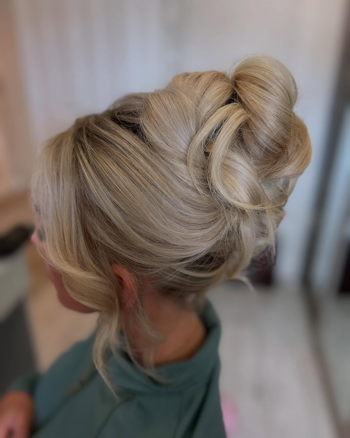 5. Blonde Sculpted High Bun (Updo Hairstyles)