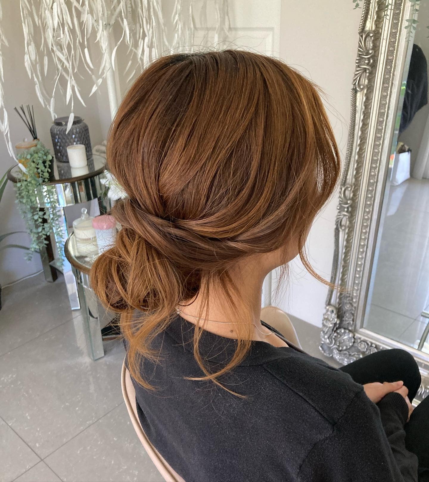14. Loose Textured Low Bun in Warm Copper Brown (Bridesmaid Hairstyles)