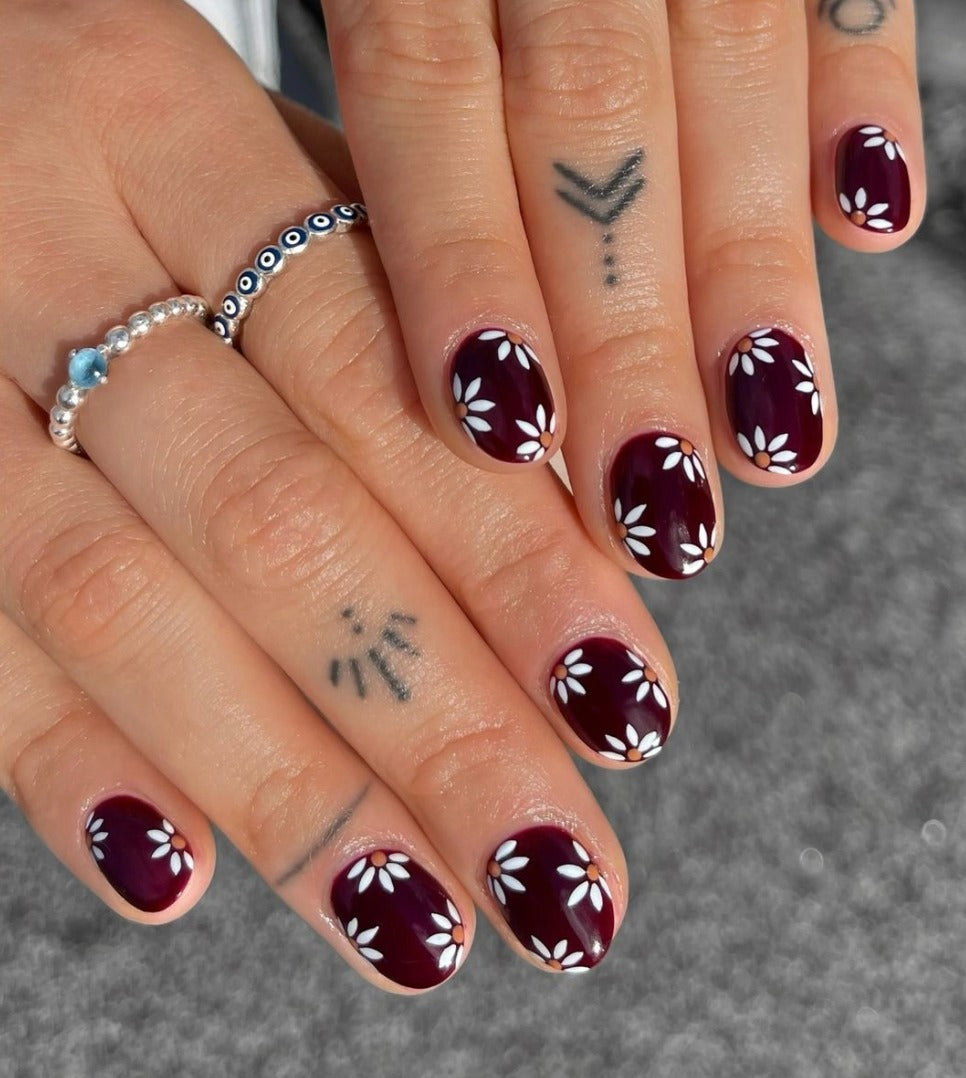 16. Burgundy with White Daisy Details (Burgundy Nail Ideas)