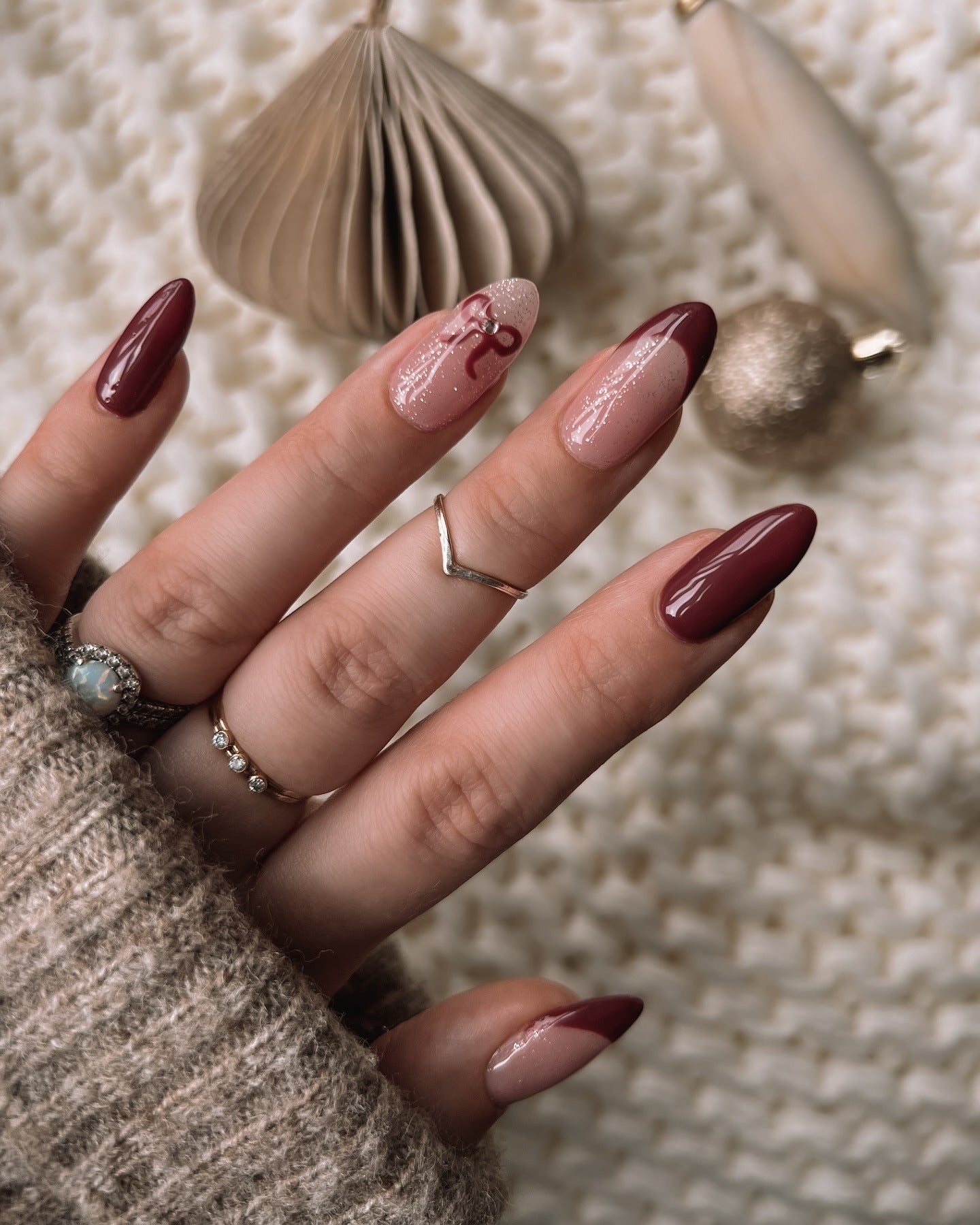 17. Burgundy French with Sparkle and Bow Accent (Burgundy Nail Ideas)