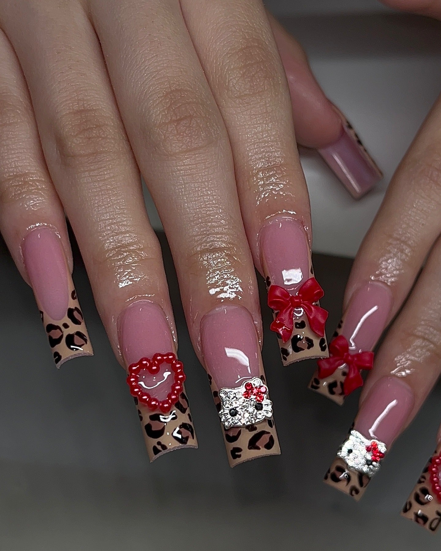 2. Cheetah Print Glam with Red Bows (Cheetah Nail Ideas)