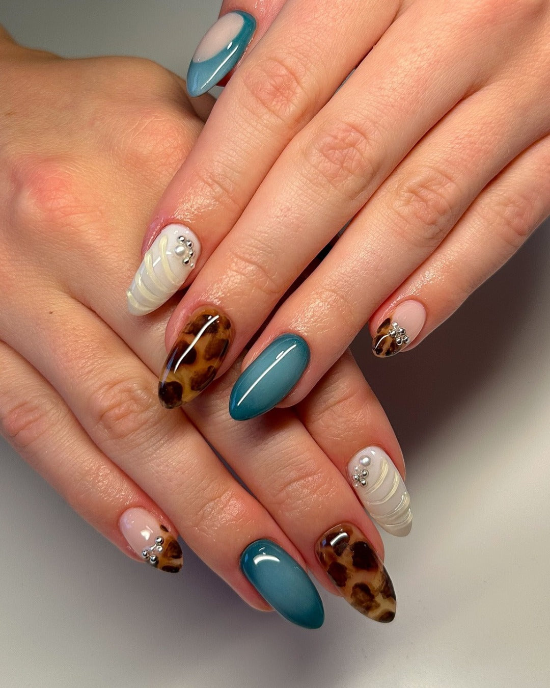 5. Ocean Teal and Leopard Blend (Cheetah Nail Ideas)