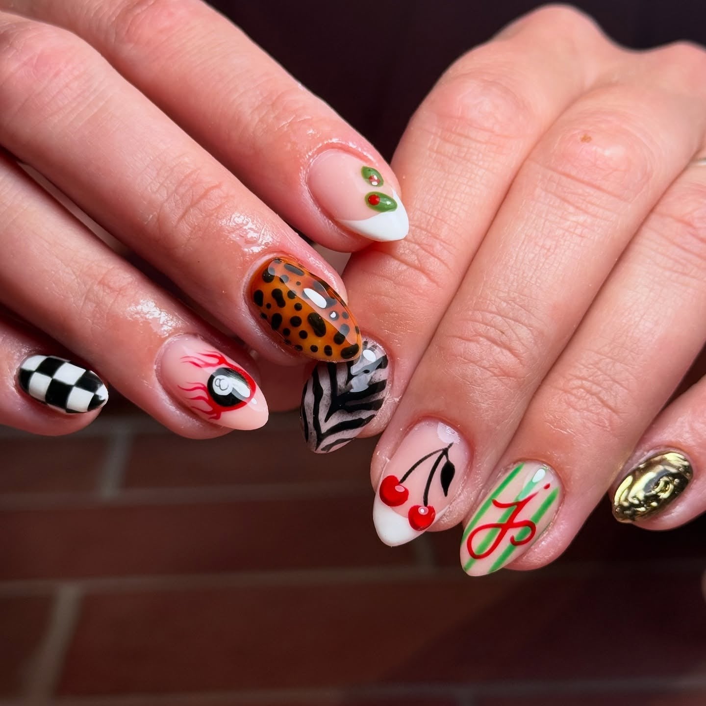 8. Eclectic Cheetah Mix with Graphic Art (Cheetah Nail Ideas)