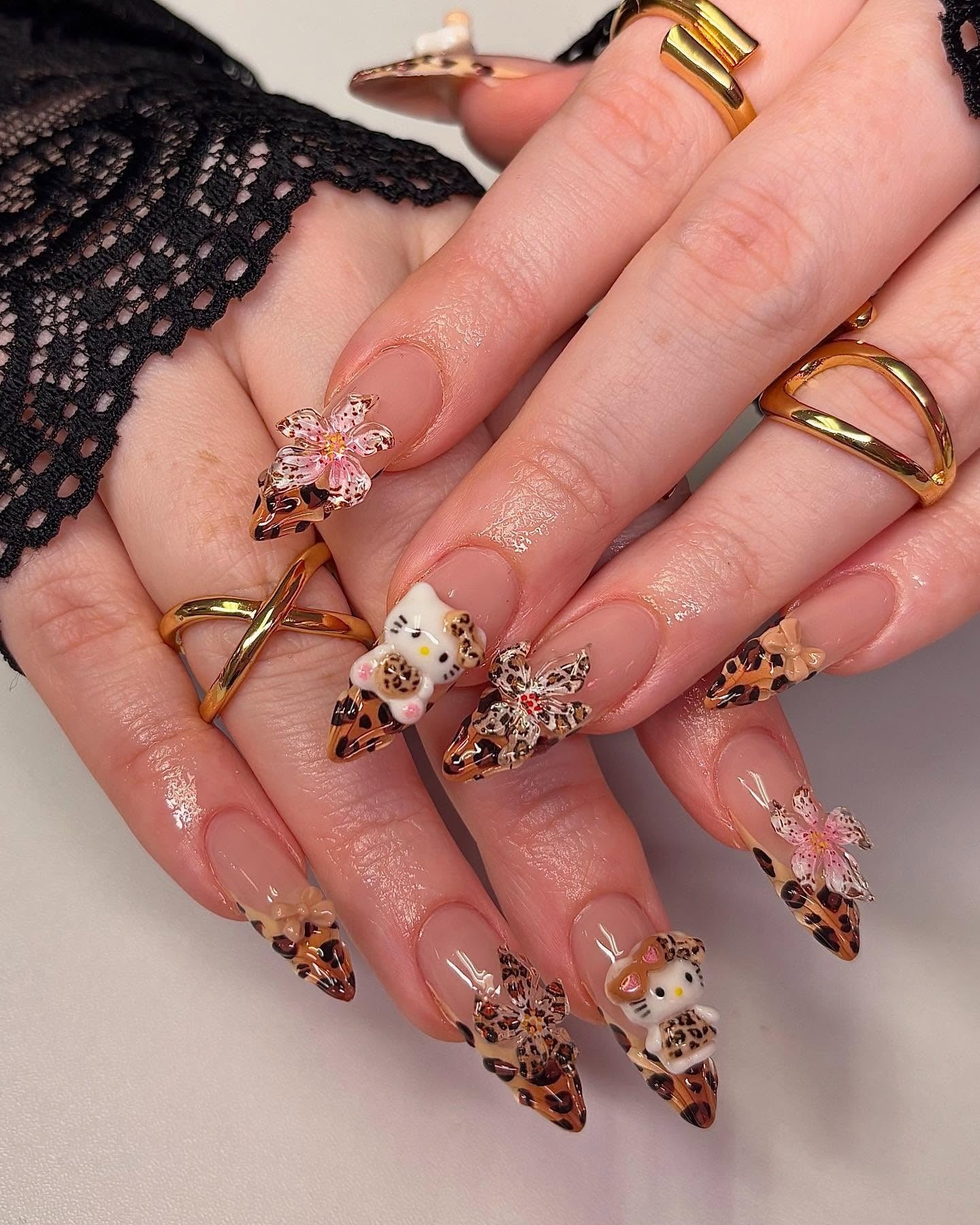 10. Cheetah and Floral Fantasy with 3D Figures (Cheetah Nail Ideas)