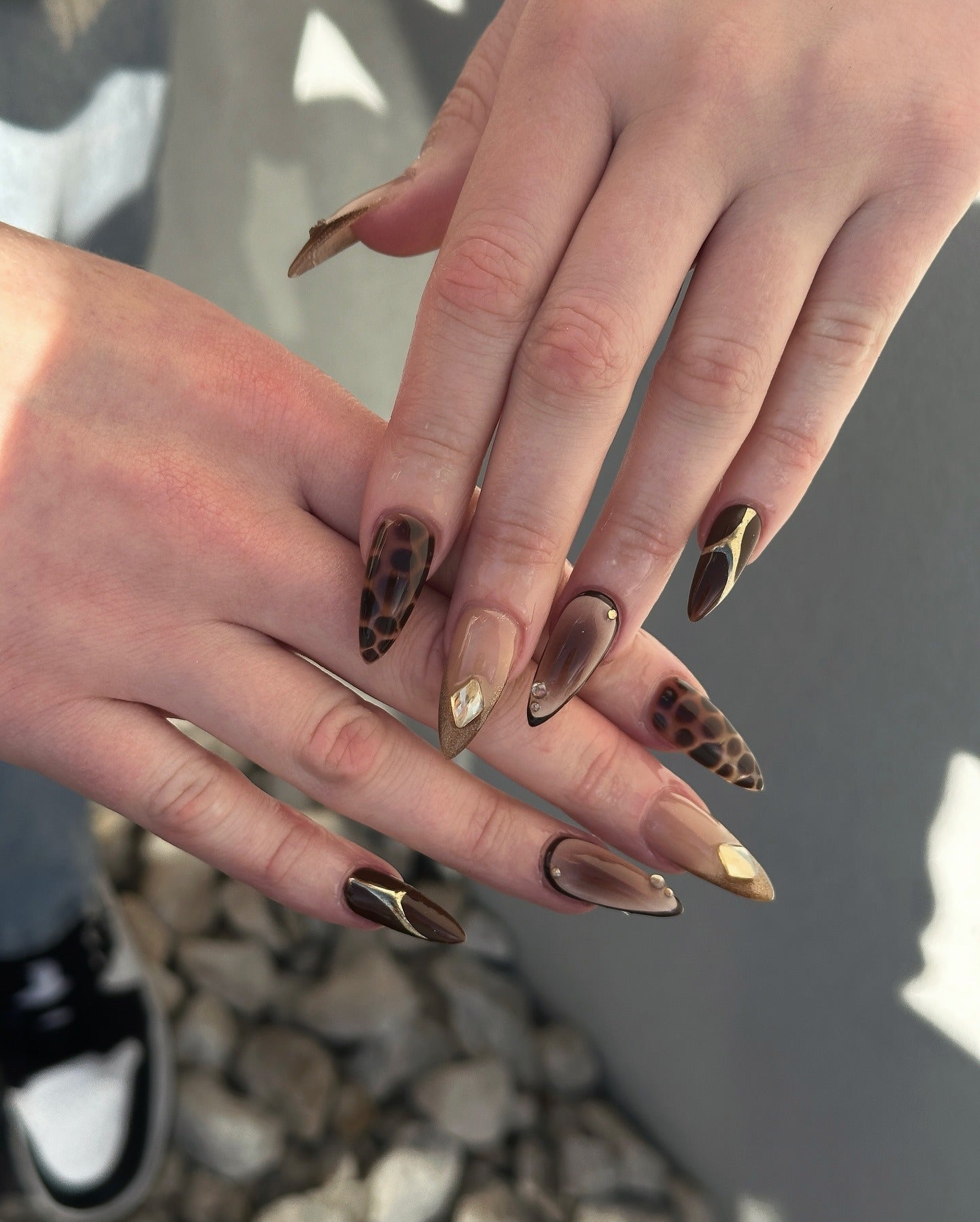 13. Deep Mocha Cheetah with Gold Embellishments (Cheetah Nail Ideas)