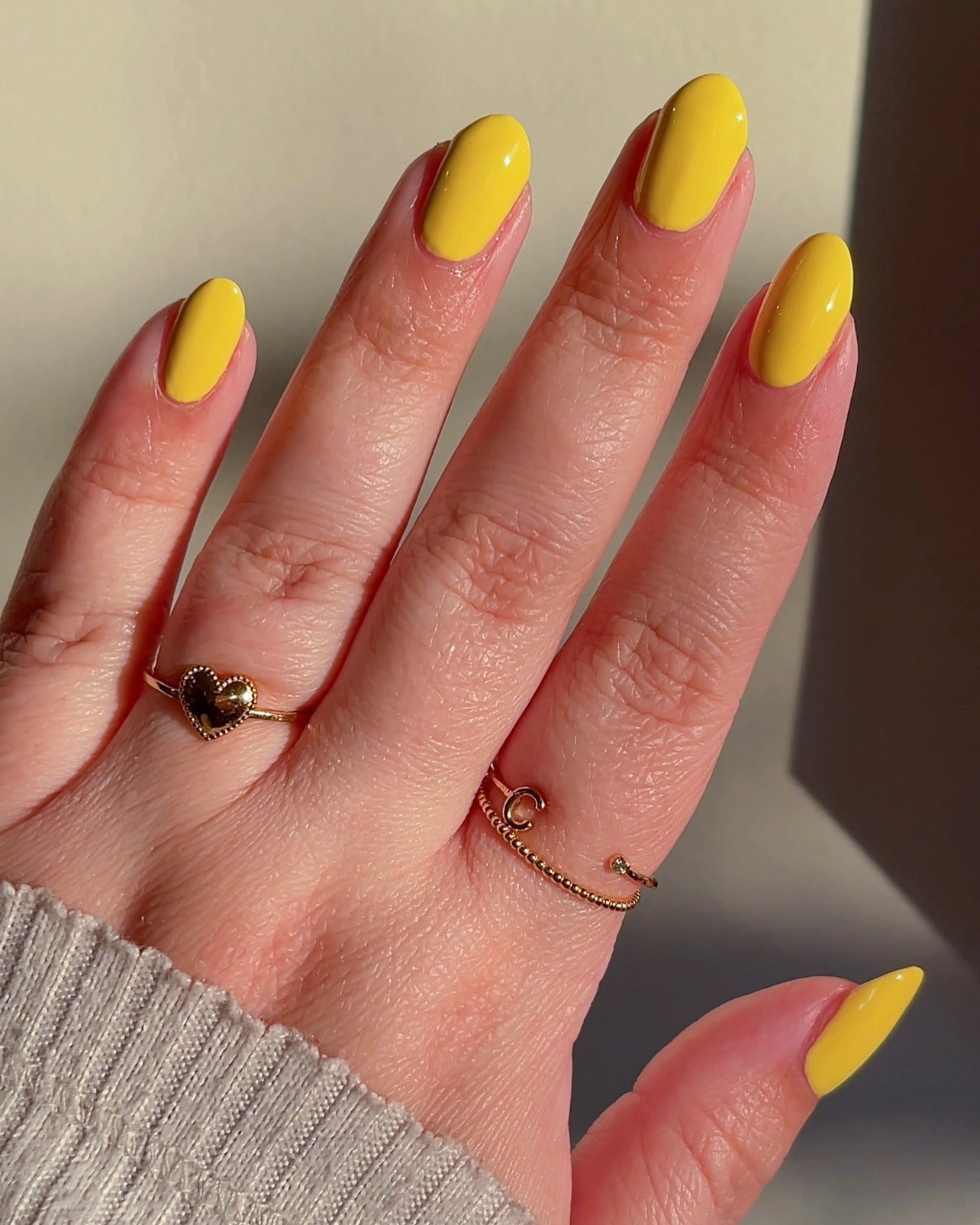 14. Glossy Goldenrod Oval Nails (Yellow Nail Ideas)