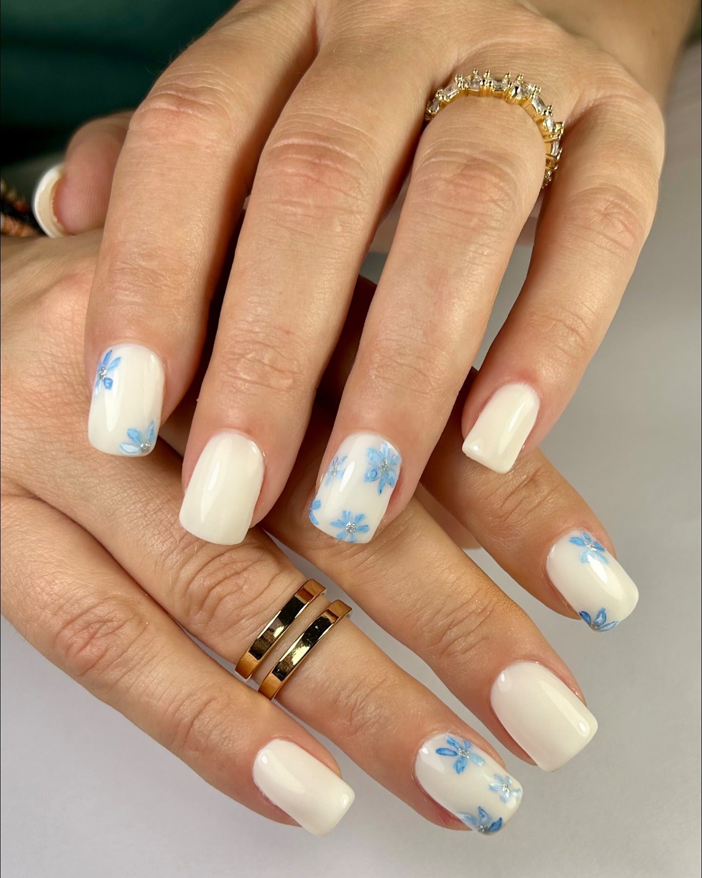 2. Milky White Nails with Blue Floral Accents (Milky Nail Ideas)