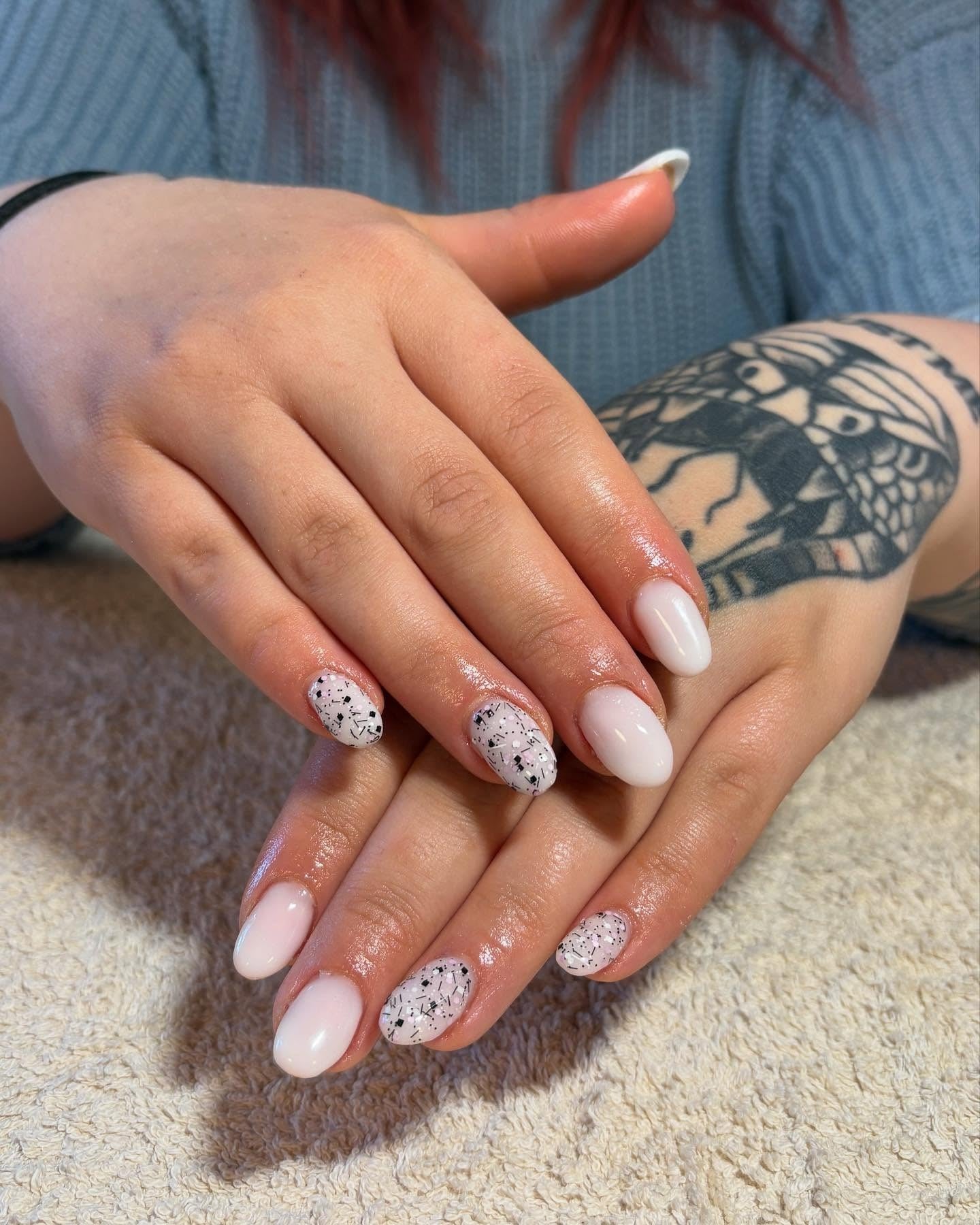 6. Milky Nails with Black Speckled Accents (Milky Nail Ideas)