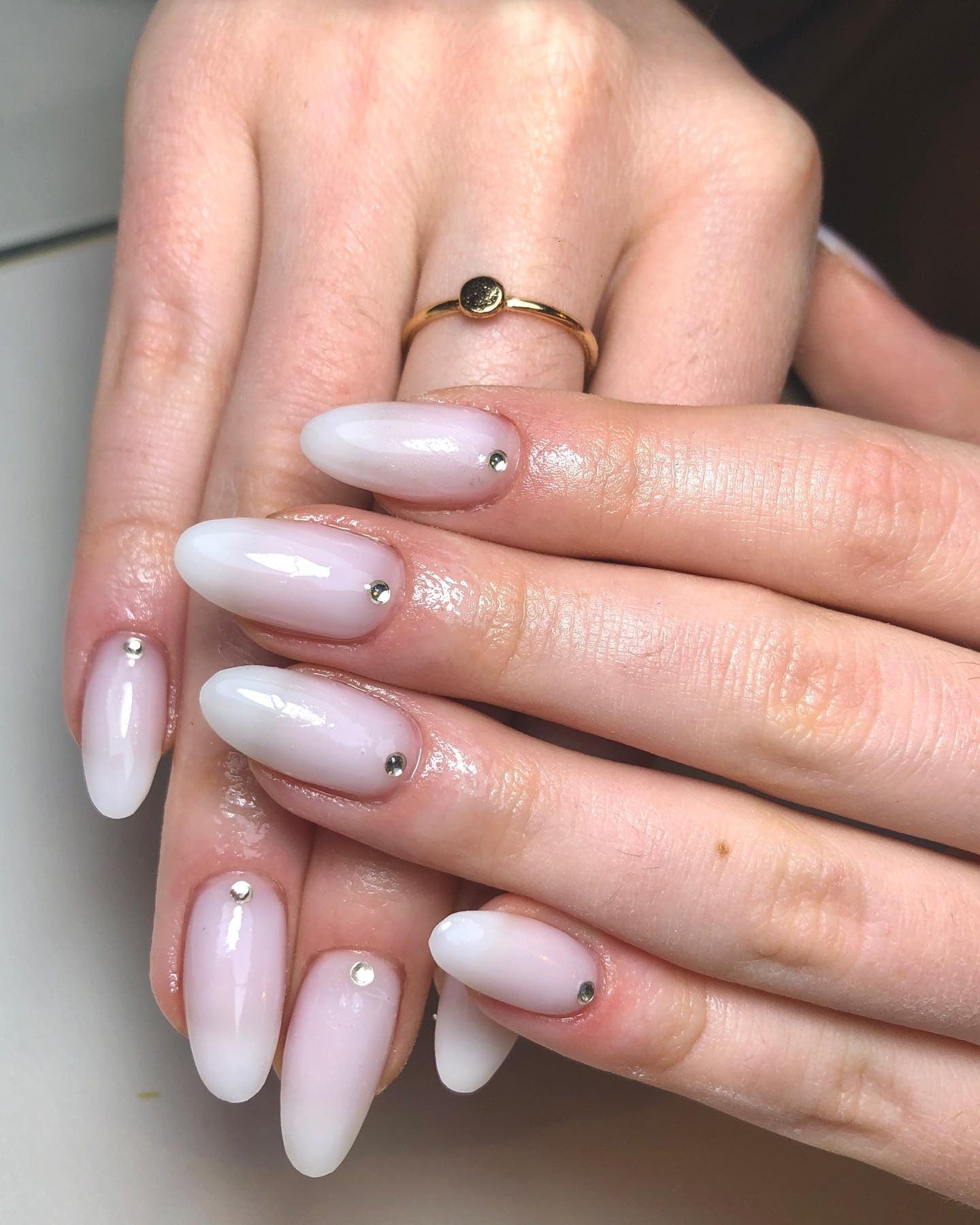 15. Milky Almond Nails with Silver Cuticle Crystals (Milky Nail Ideas)