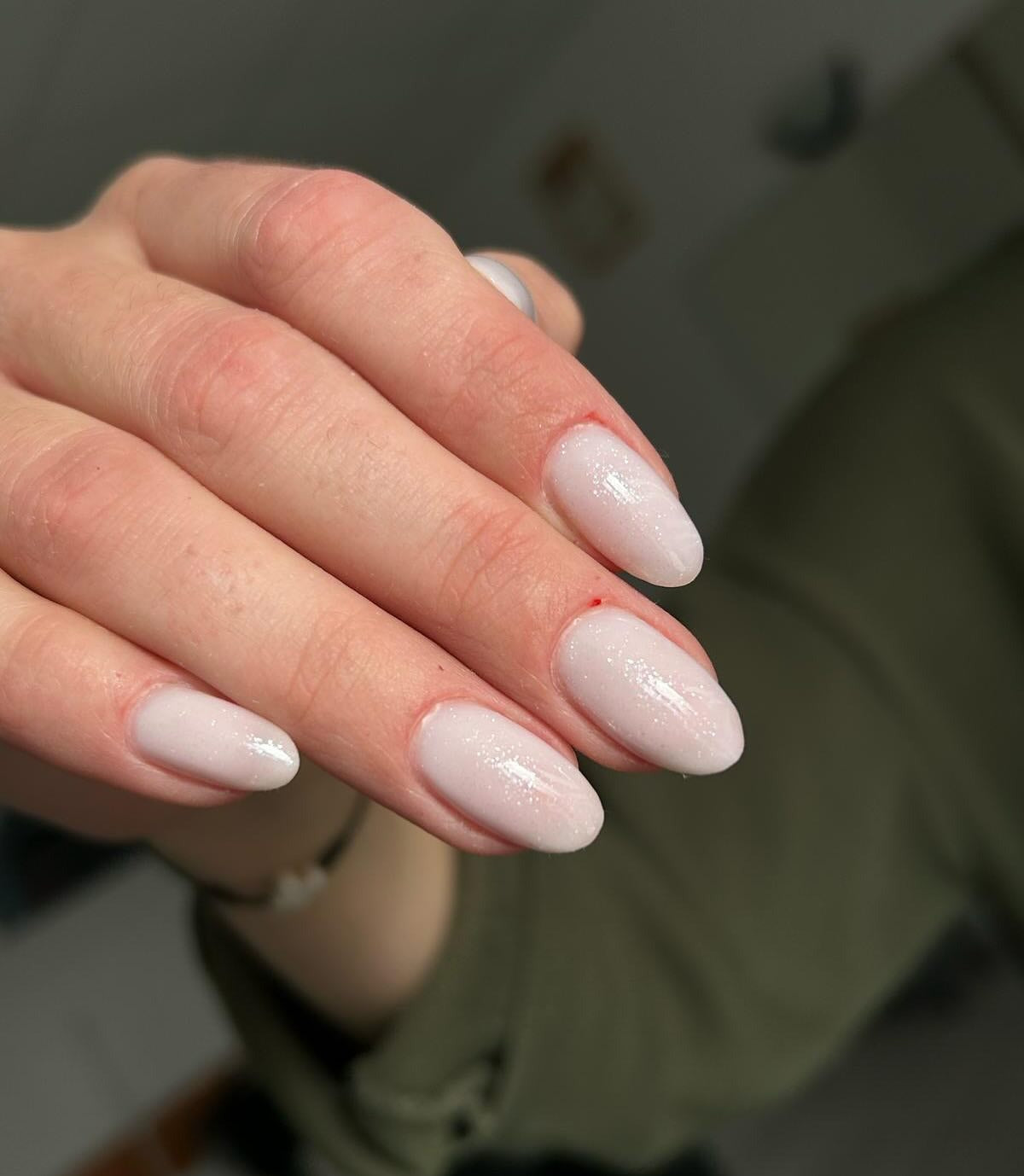 18. Soft Milky Almond Nails with Shimmer Glaze (Milky Nail Ideas)