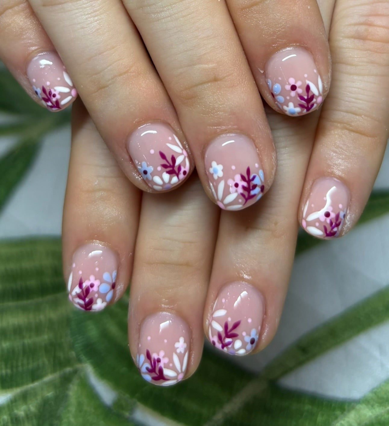 5. Delicate Floral Tips (Floral Nail Ideas)