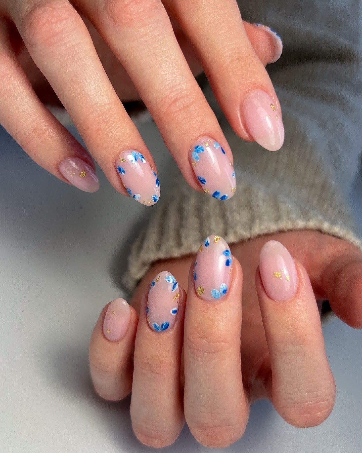 6. Blue Petal Charm (Floral Nail Ideas)