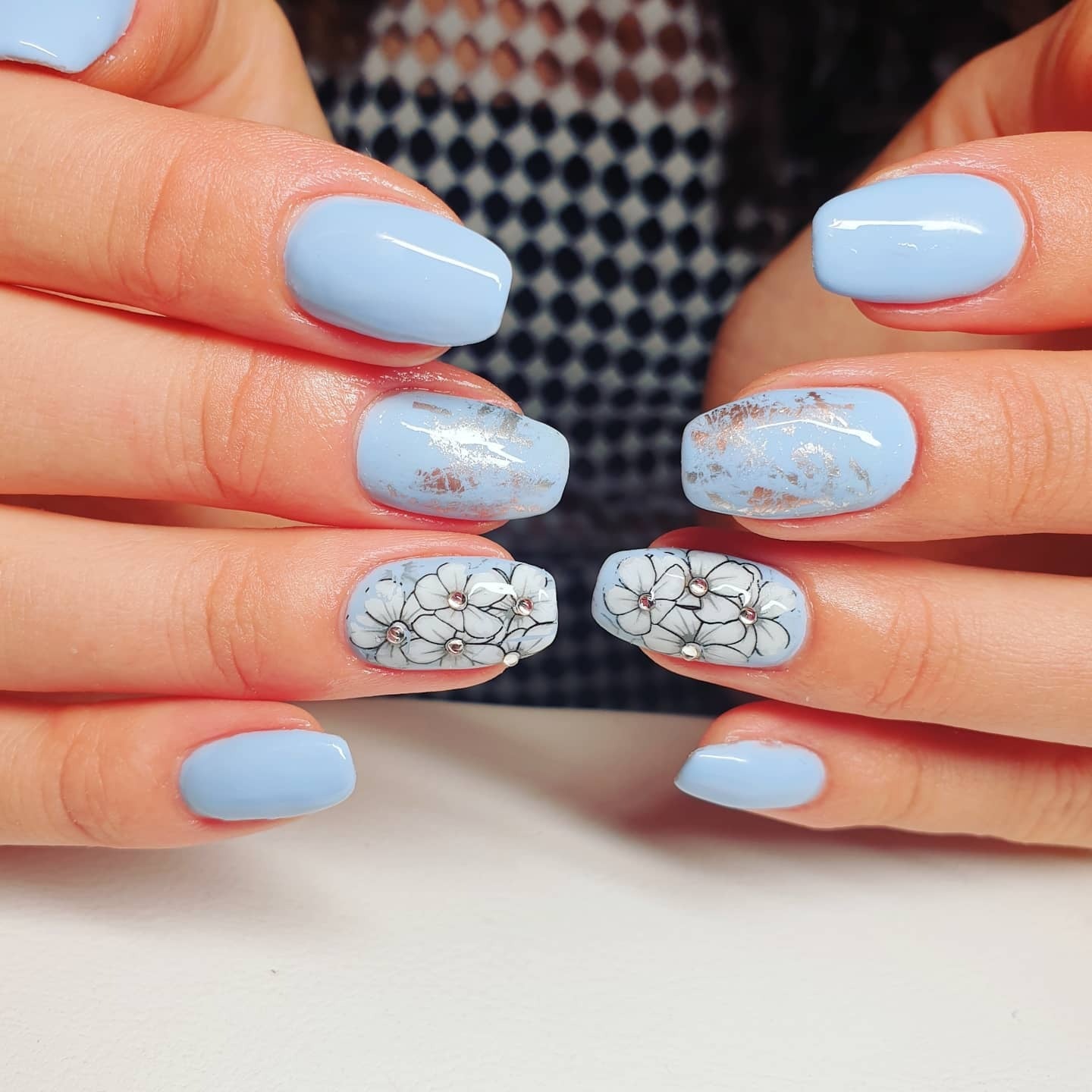 1. Soft Blue Nails with Metallic and Floral Accents (Light Blue Nail Ideas)