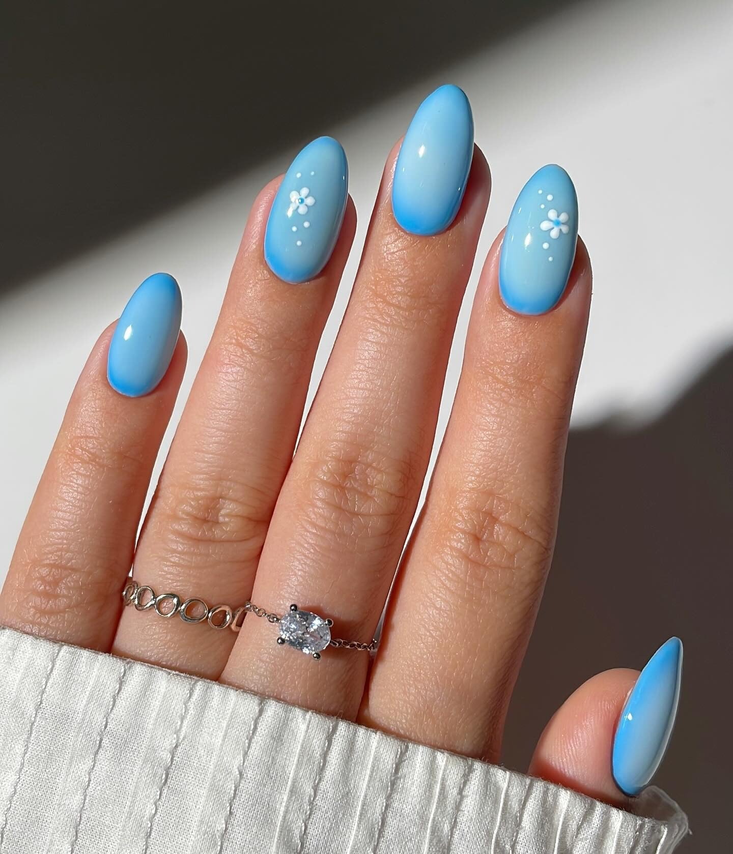 12. Gradient Blue Nails with Mini Florals (Light Blue Nail Ideas)