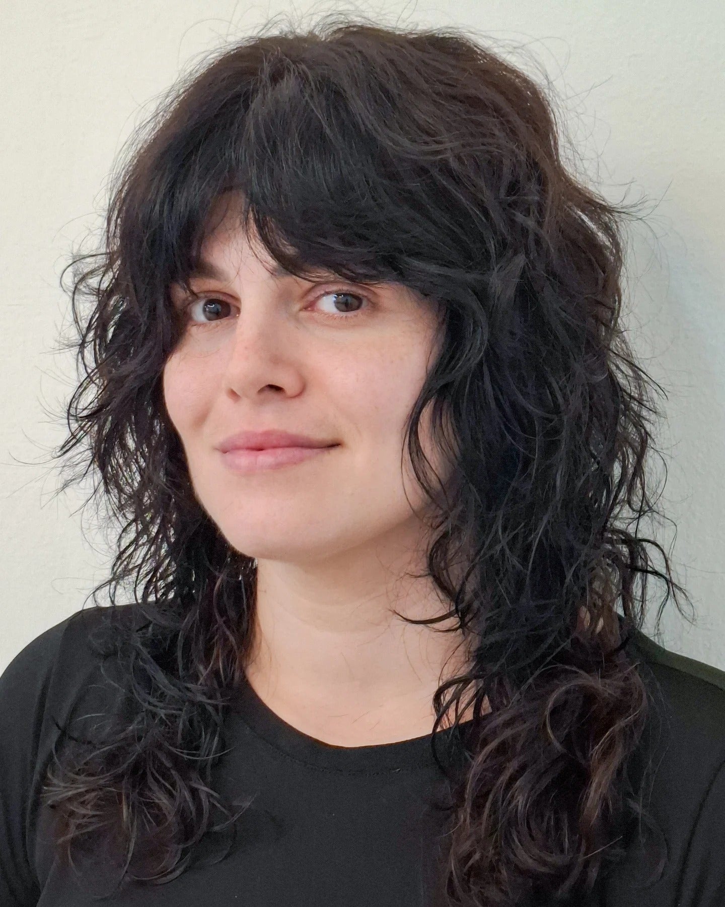 4. Tousled Black Curly Shag (Shaggy Haircut)