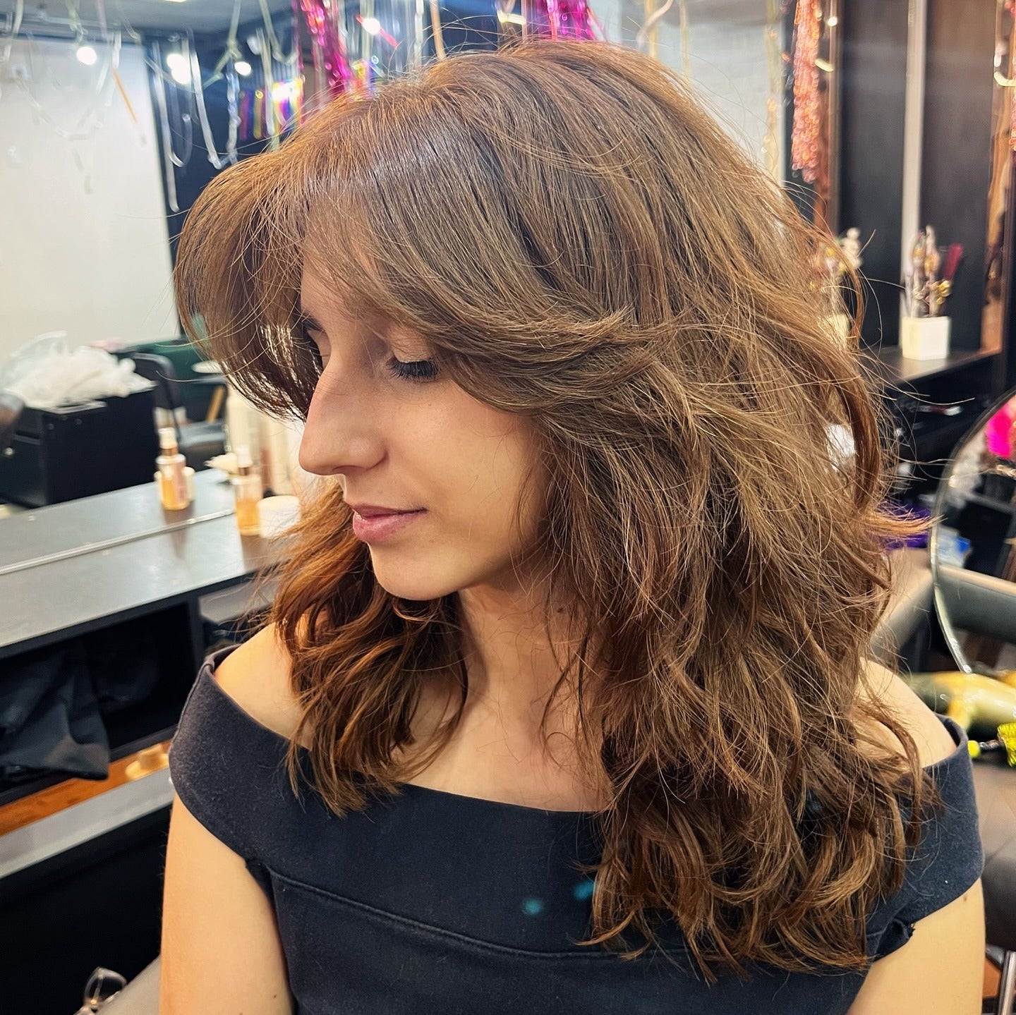 7. Light Chestnut Layered Shag with Side Sweep (Shaggy Haircut)