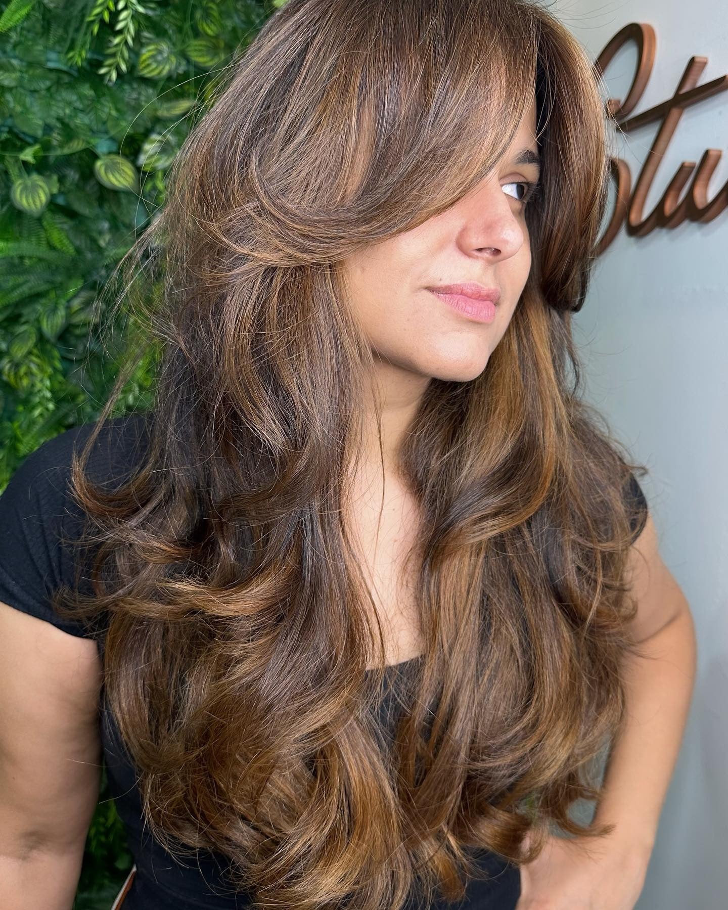 12. Caramel Layered Shag with Curtain Bangs (Shaggy Haircut)