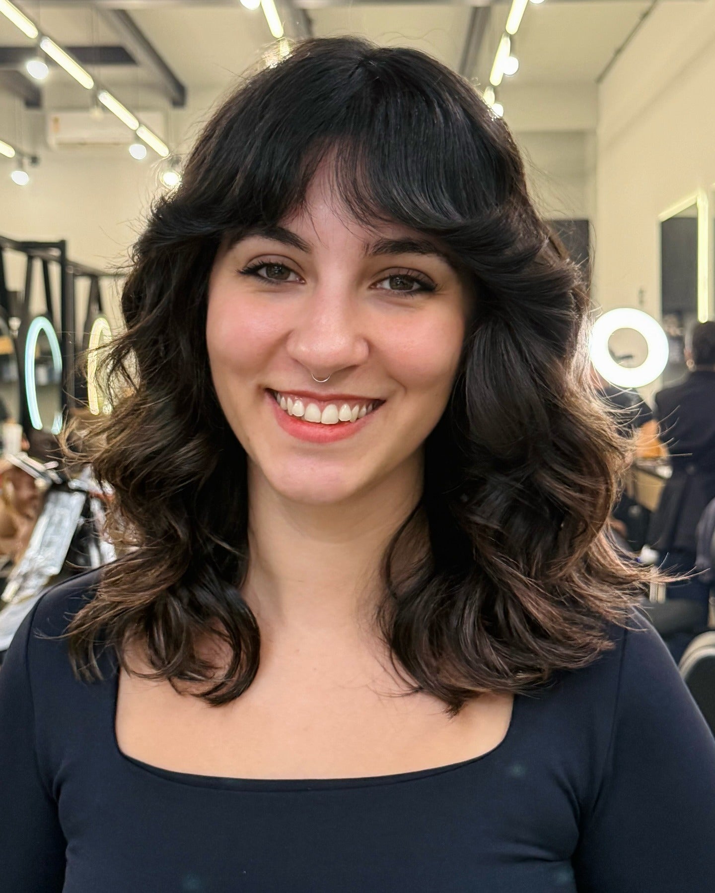 13. Medium Wavy Shag with Rounded Bangs (Shaggy Haircut)