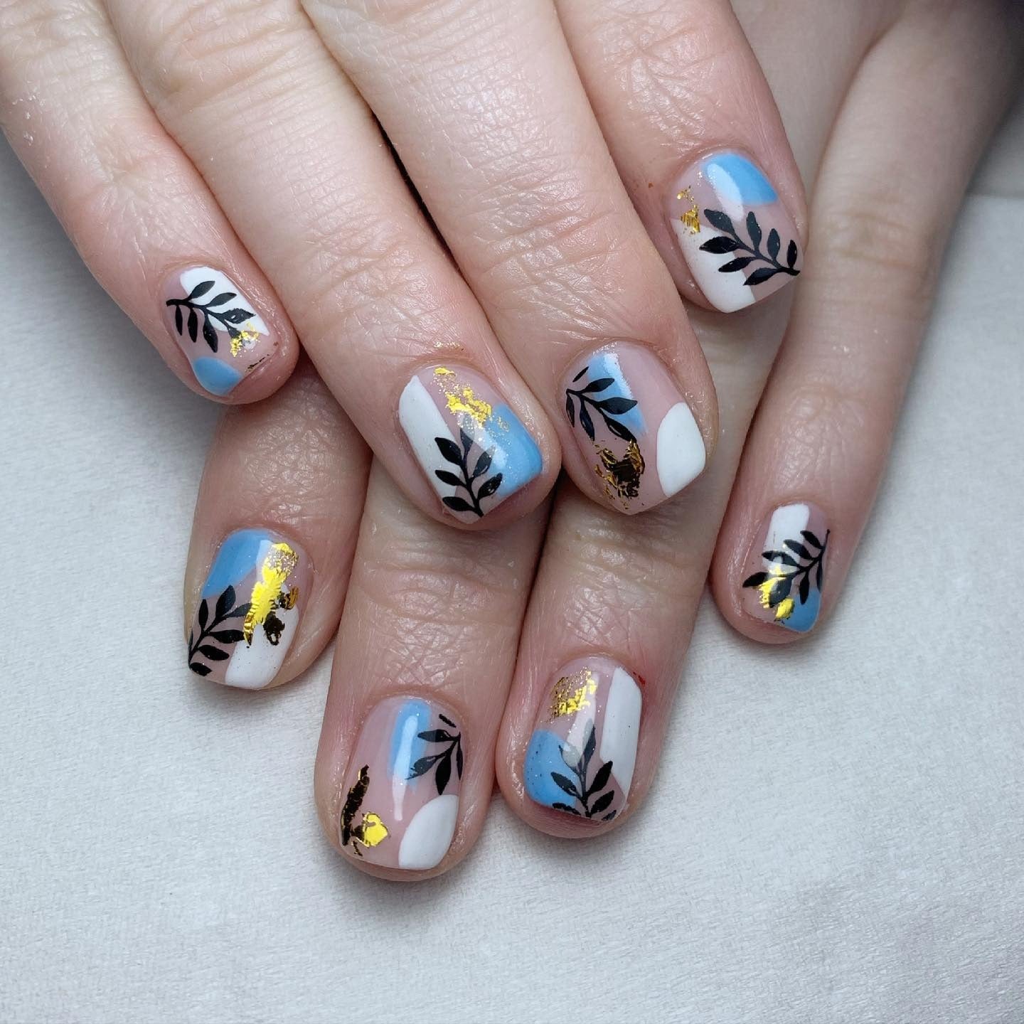 2. Blue and White Botanical Mix (Short Nail Ideas)