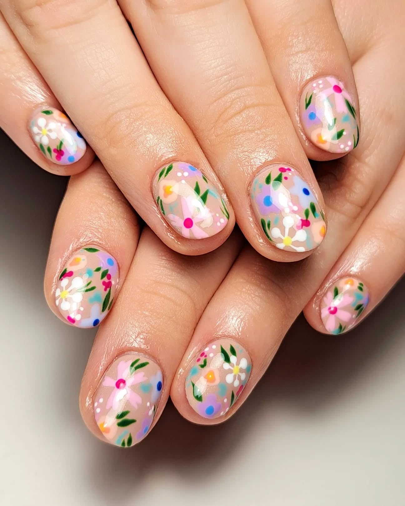 5. Wildflower Scatter on Clear Pink (Short Nail Ideas)