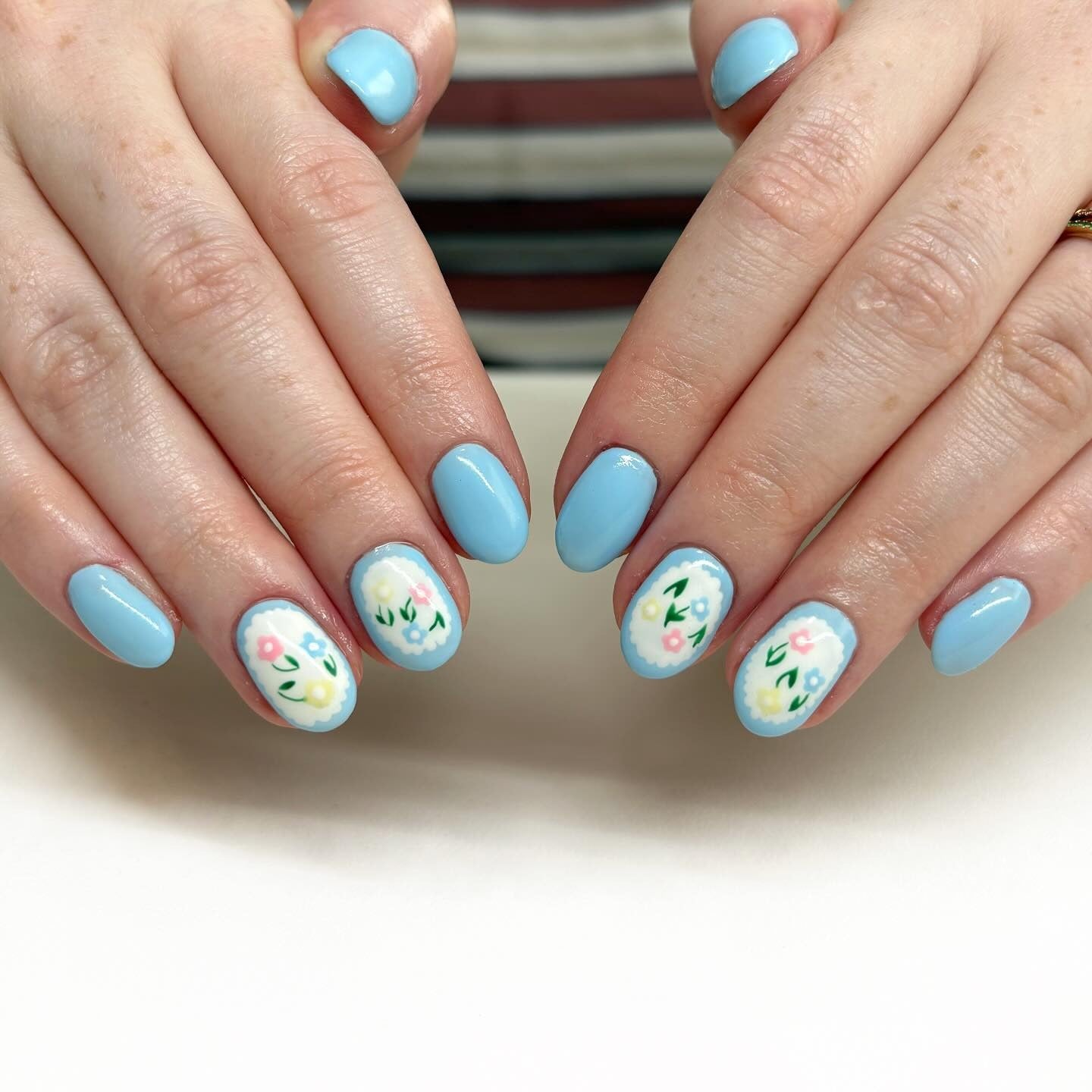 2. Baby Blue Blossoms with Floral Accents (Blue Spring Nail Ideas)