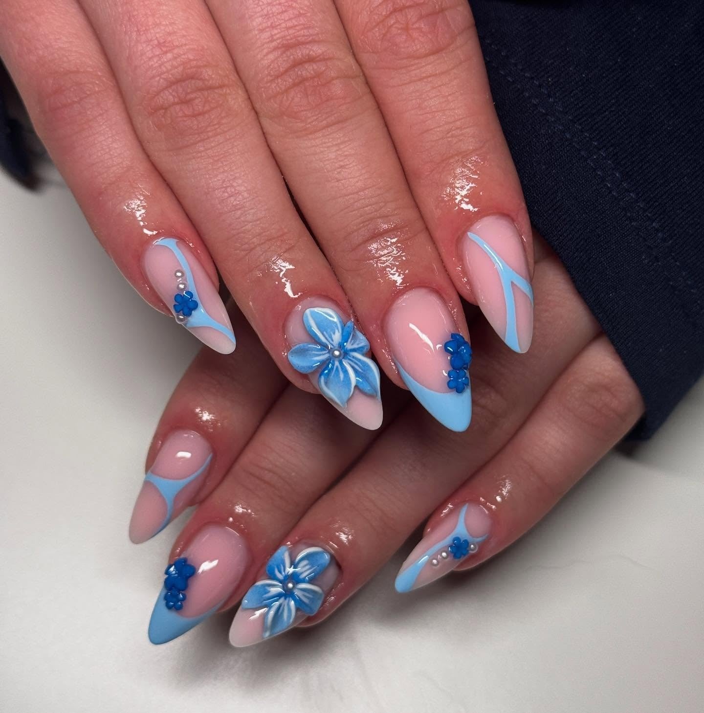 12. 3D Bloom and Sky Blue Geometry (Blue Spring Nail Ideas)