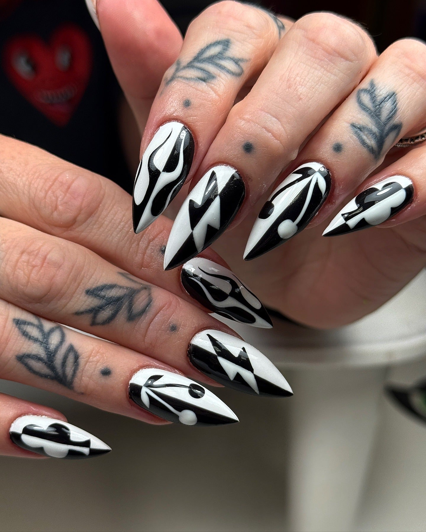12. Abstract Lightning Stiletto Nails (Black and White Nail Ideas)