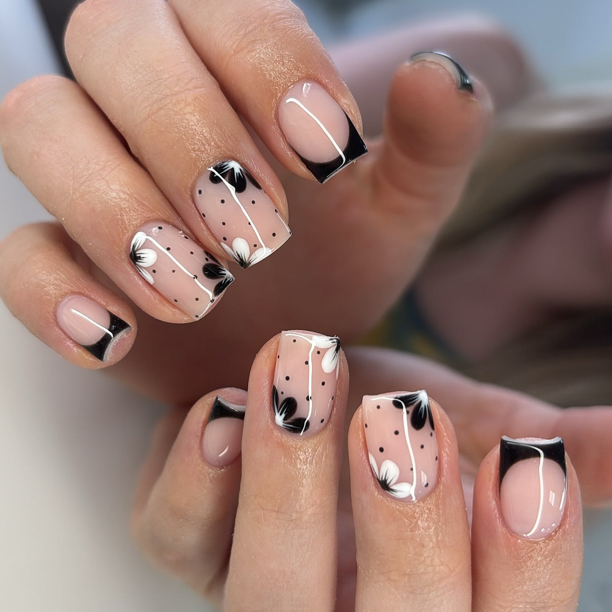 14. Short Floral Dots with Black Tips (Black and White Nail Ideas)