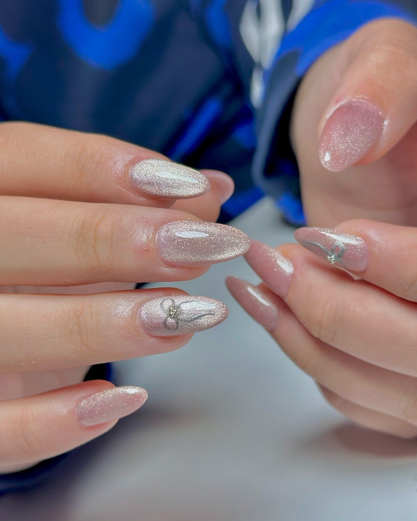 5. Glitter Dust with Silver Chrome Bows (Nail Ideas for Wedding)