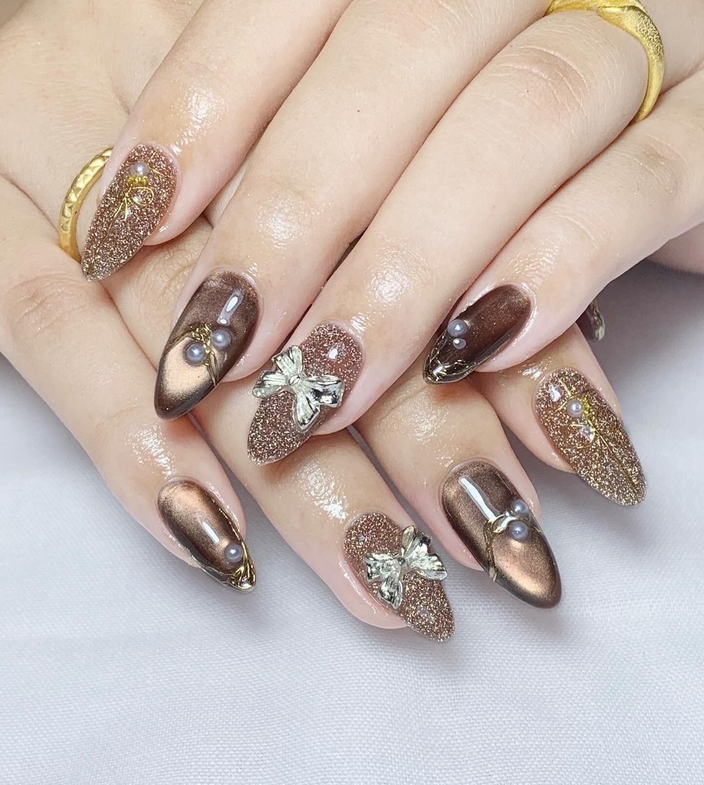 10. Bronze Glitz with Embossed Butterflies (Nail Ideas for Wedding)