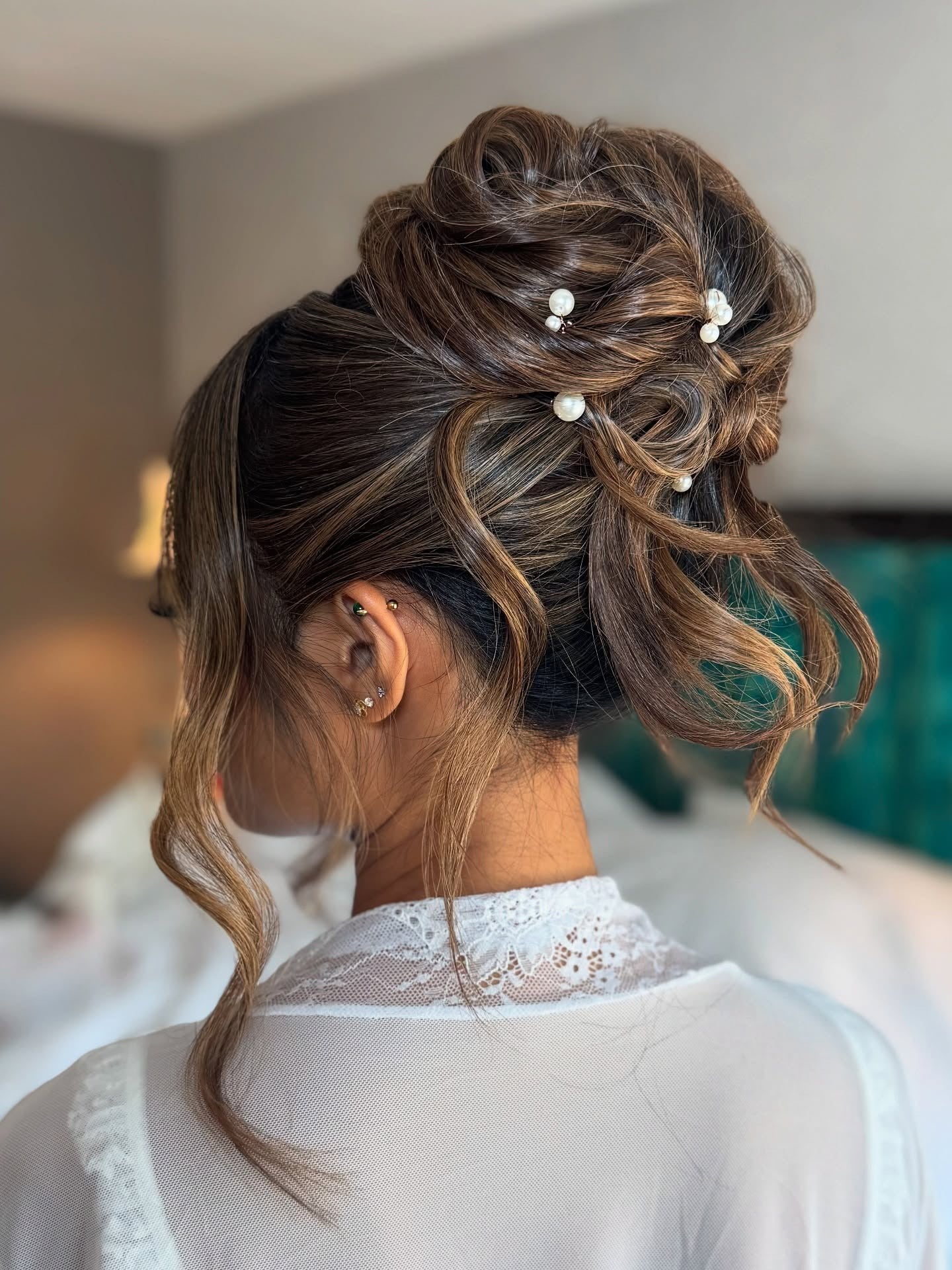 1. Elegant Brunette Updo with Pearl Accents (Wedding Hairstyles)