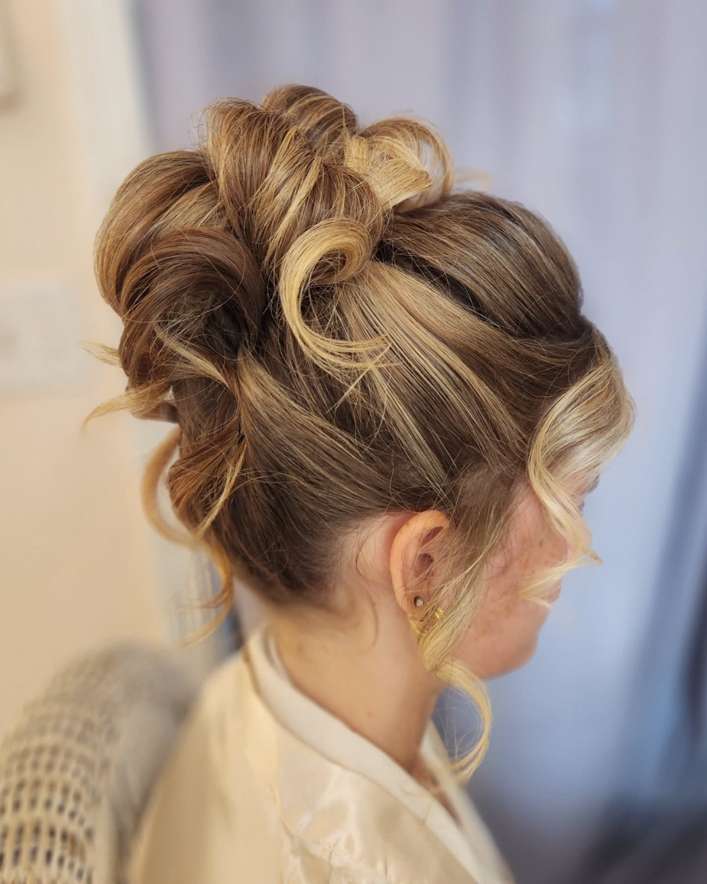 6. Voluminous Updo with Curled Strands (Wedding Hairstyles)